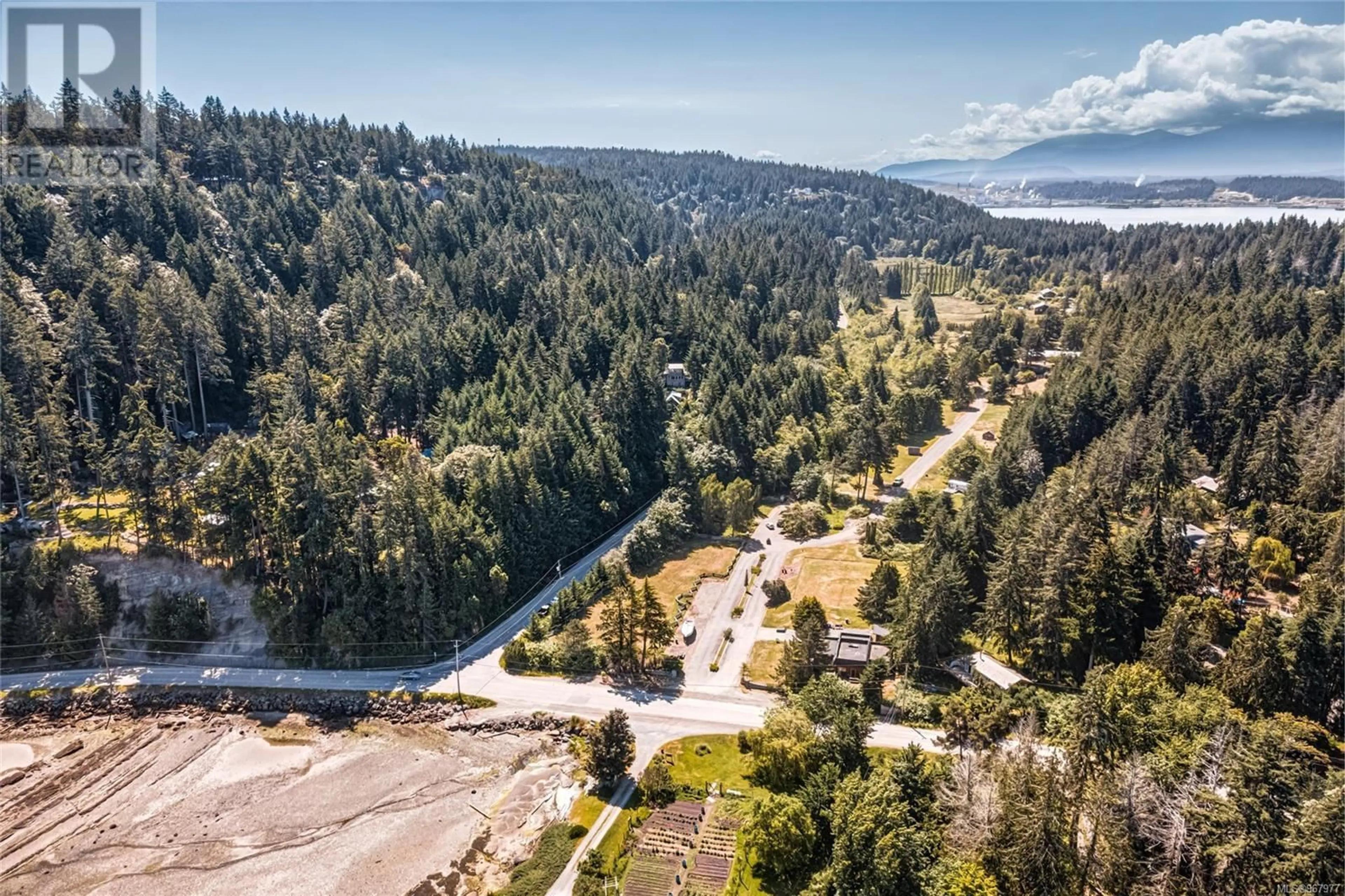 A pic from outside/outdoor area/front of a property/back of a property/a pic from drone, forest/trees view for 215 Easthom Rd, Gabriola Island British Columbia V0R1X2