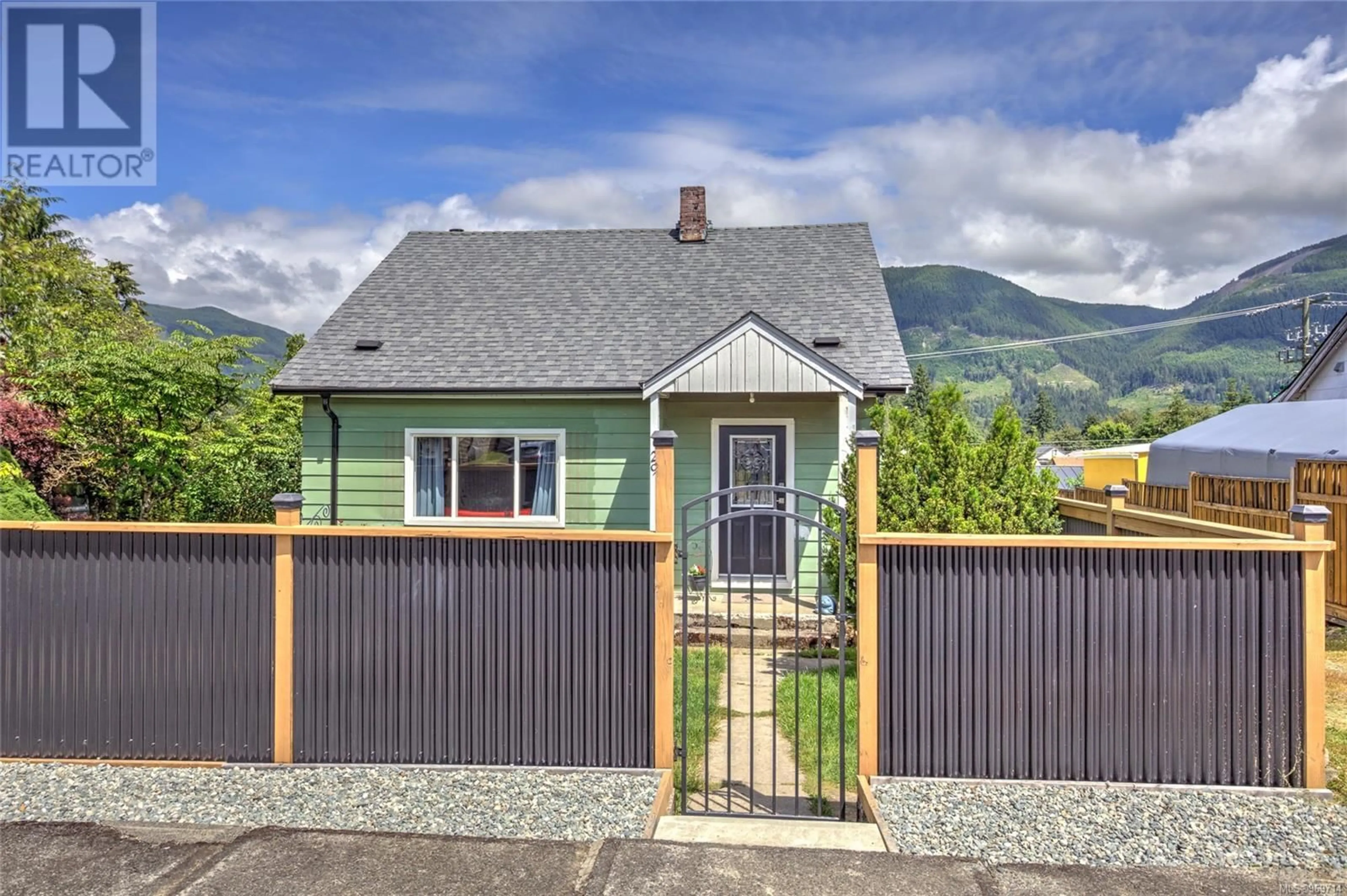 Frontside or backside of a home, the fenced backyard for 29 Arbutus St, Lake Cowichan British Columbia V0R2G0