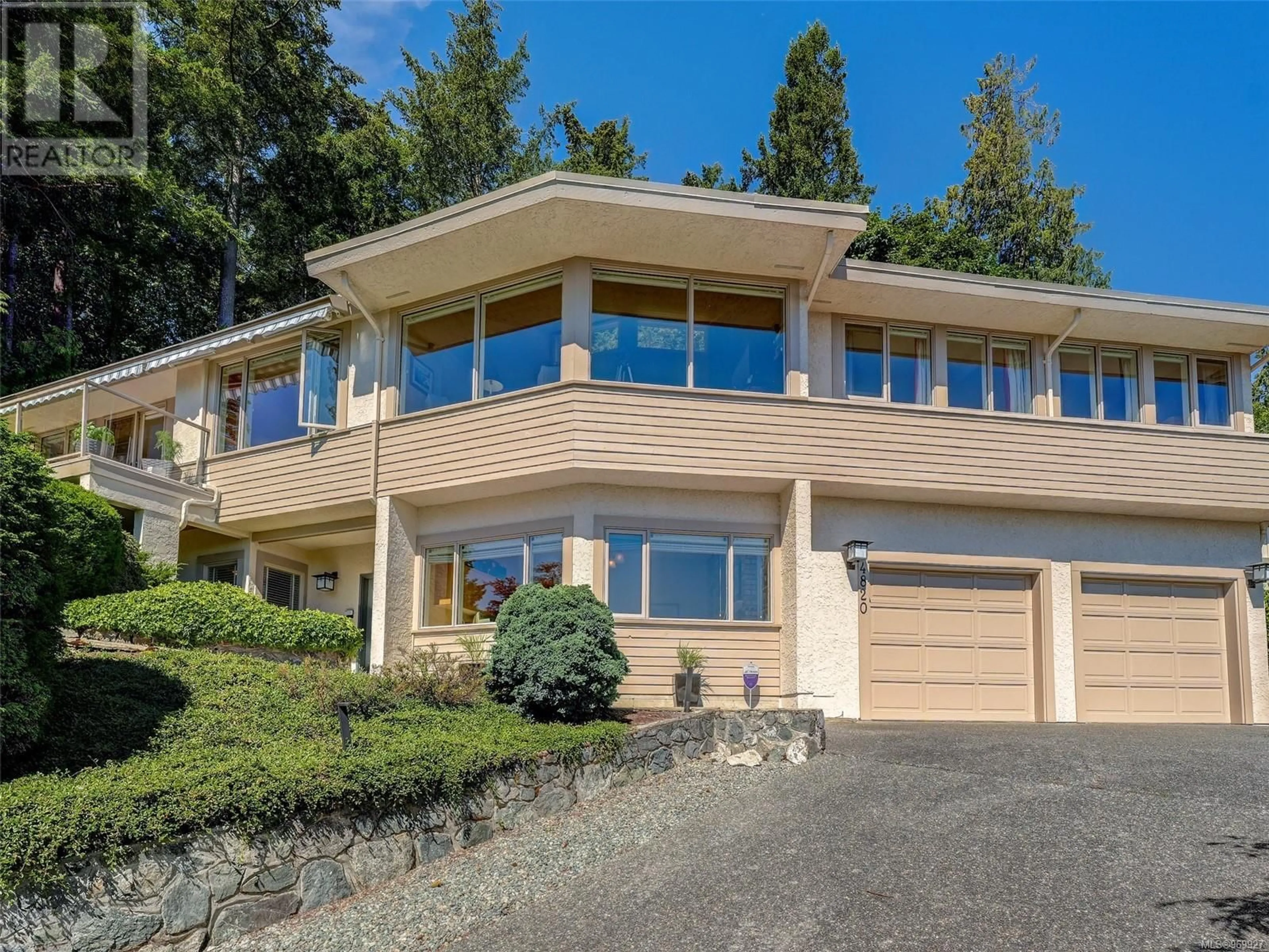 Frontside or backside of a home for 4820 Amblewood Dr, Saanich British Columbia V8Y2S4