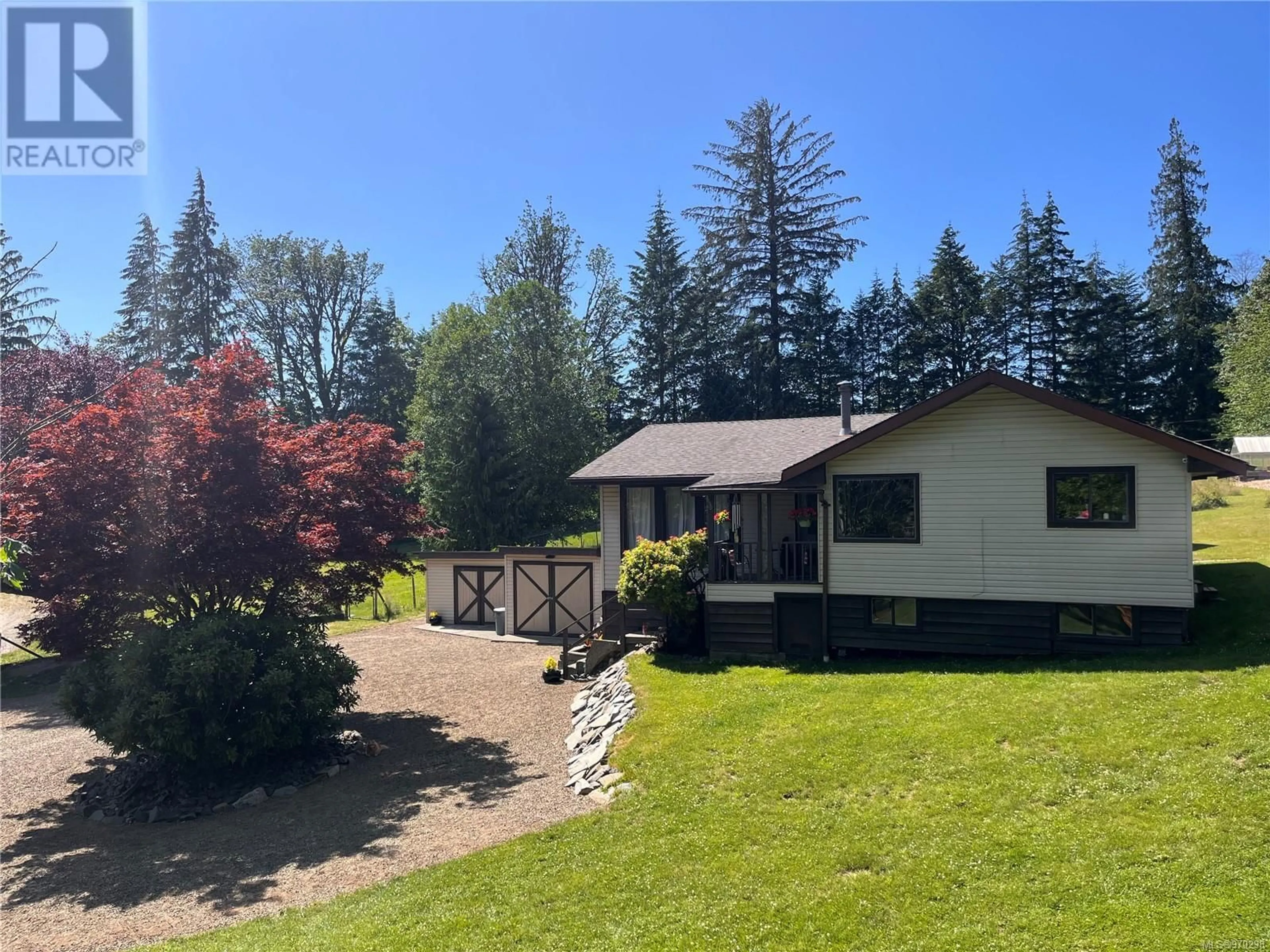 A pic from outside/outdoor area/front of a property/back of a property/a pic from drone, mountain view for 973 ISLAND HIGHWAY, Sayward British Columbia V0P1R0