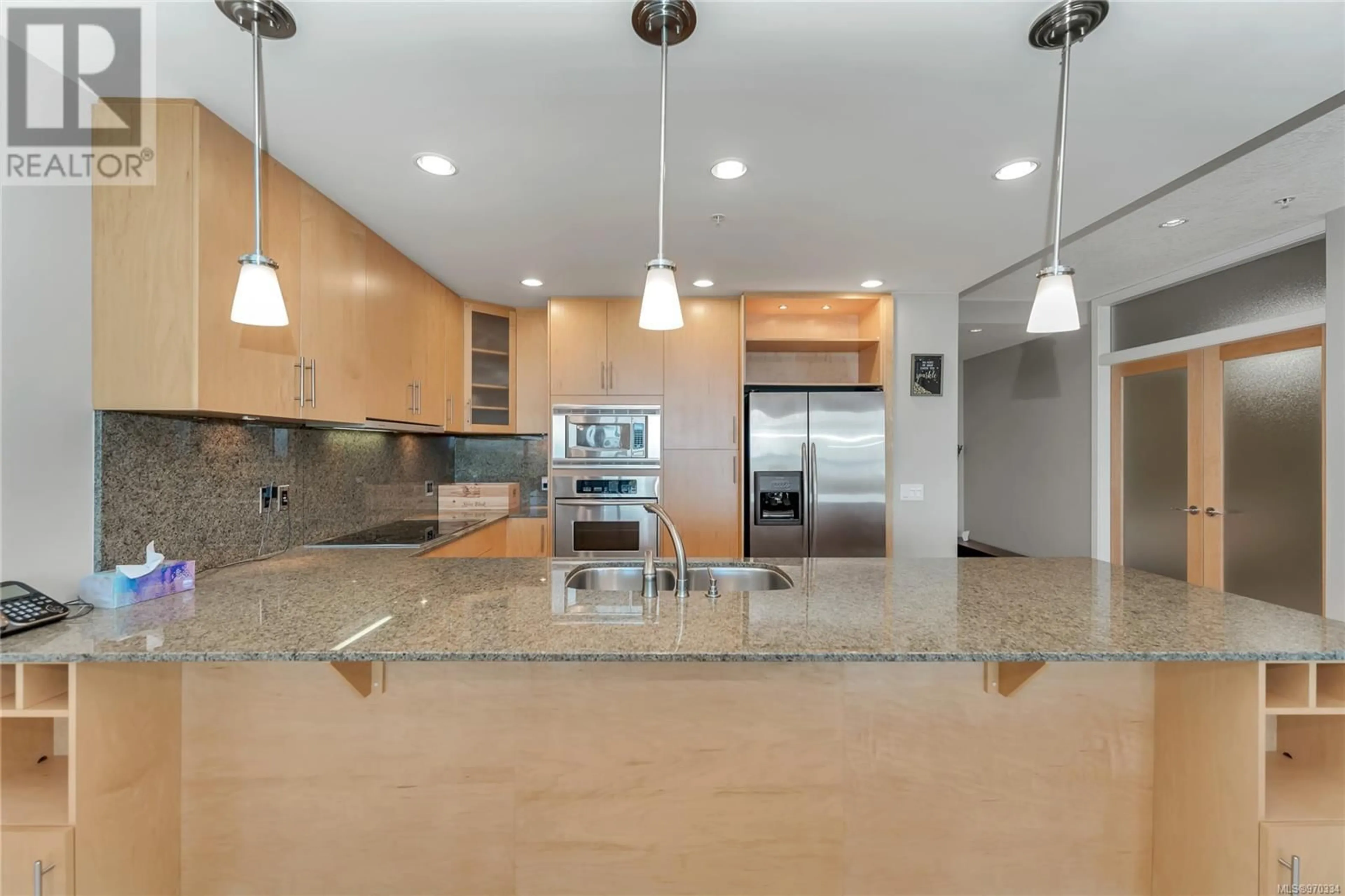 Contemporary kitchen, wood floors for 102 738 Sayward Hill Terr, Saanich British Columbia V8Y3K1