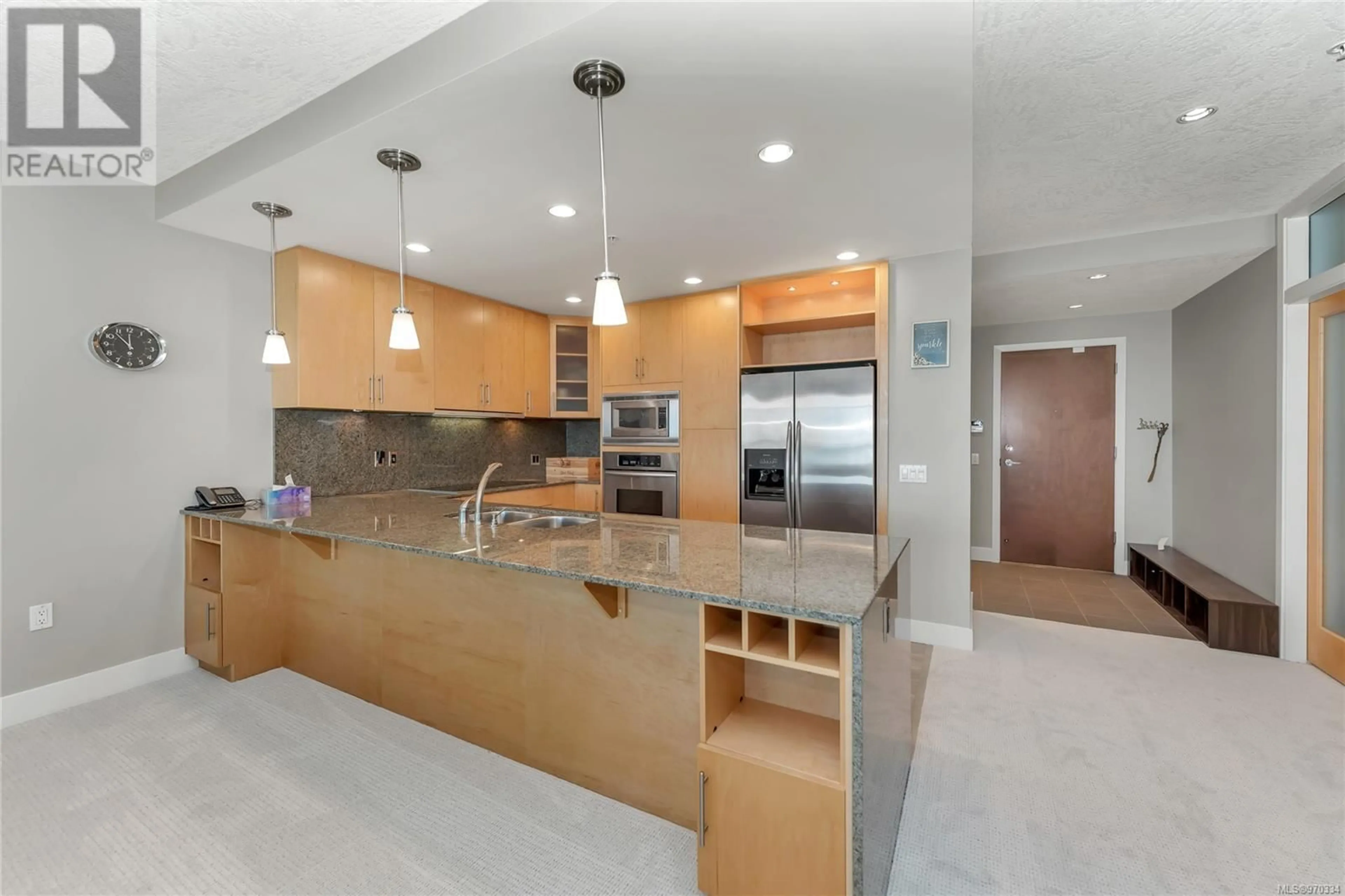 Contemporary kitchen, wood floors for 102 738 Sayward Hill Terr, Saanich British Columbia V8Y3K1