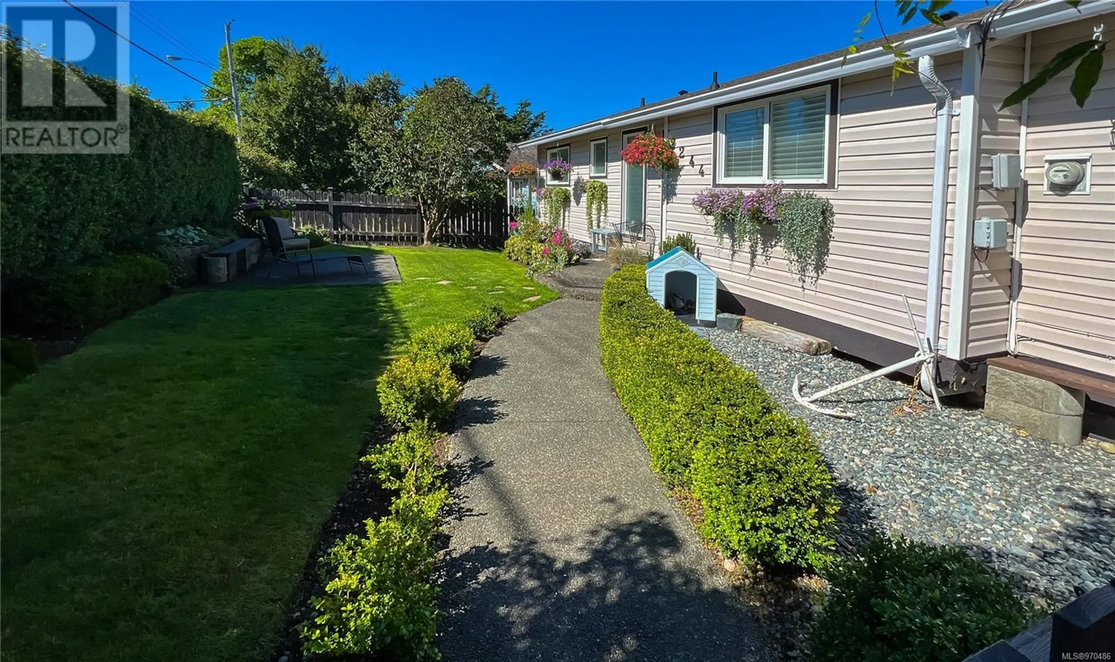 A pic from exterior of the house or condo, the fenced backyard for 2244 Haddington Cres, Port McNeill British Columbia V0N2R0