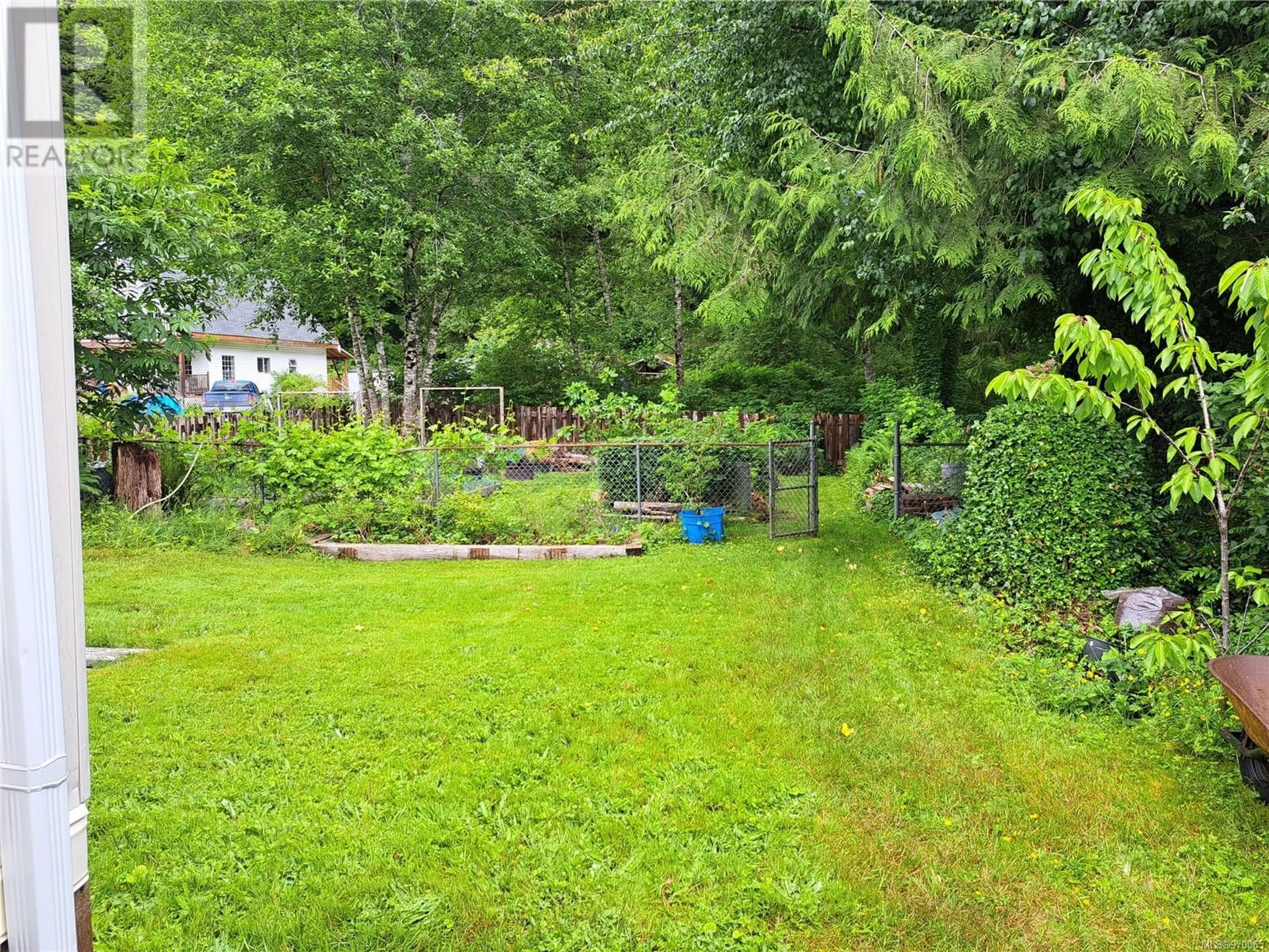 Patio, the fenced backyard for 132 Maquinna Ave, Zeballos British Columbia V0P2A0