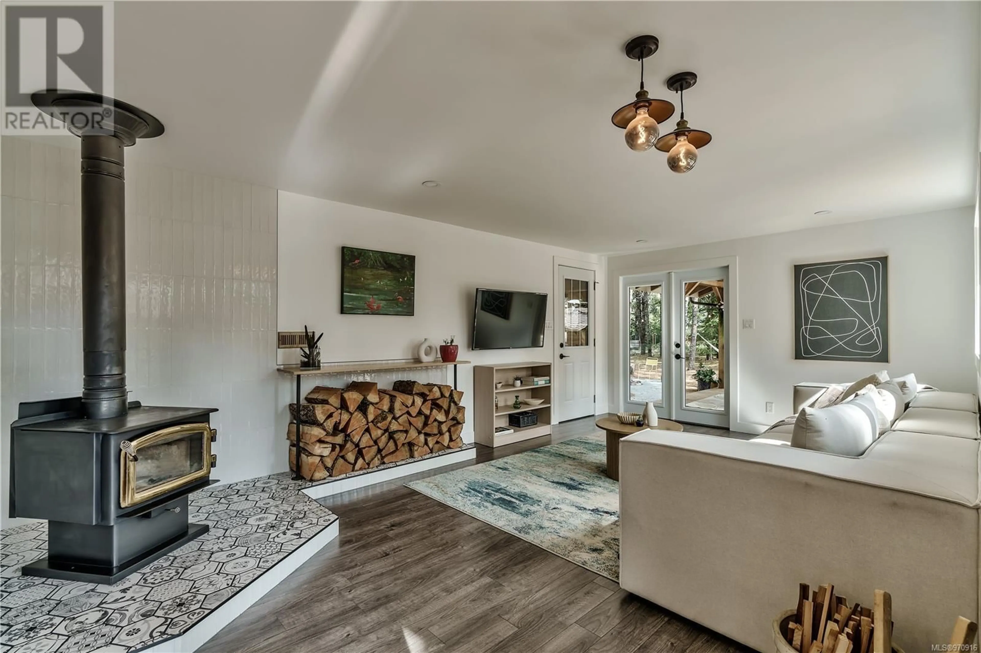 Living room with furniture, wood/laminate floor for 2965 LEON ROAD, Qualicum Beach British Columbia V9K2A2