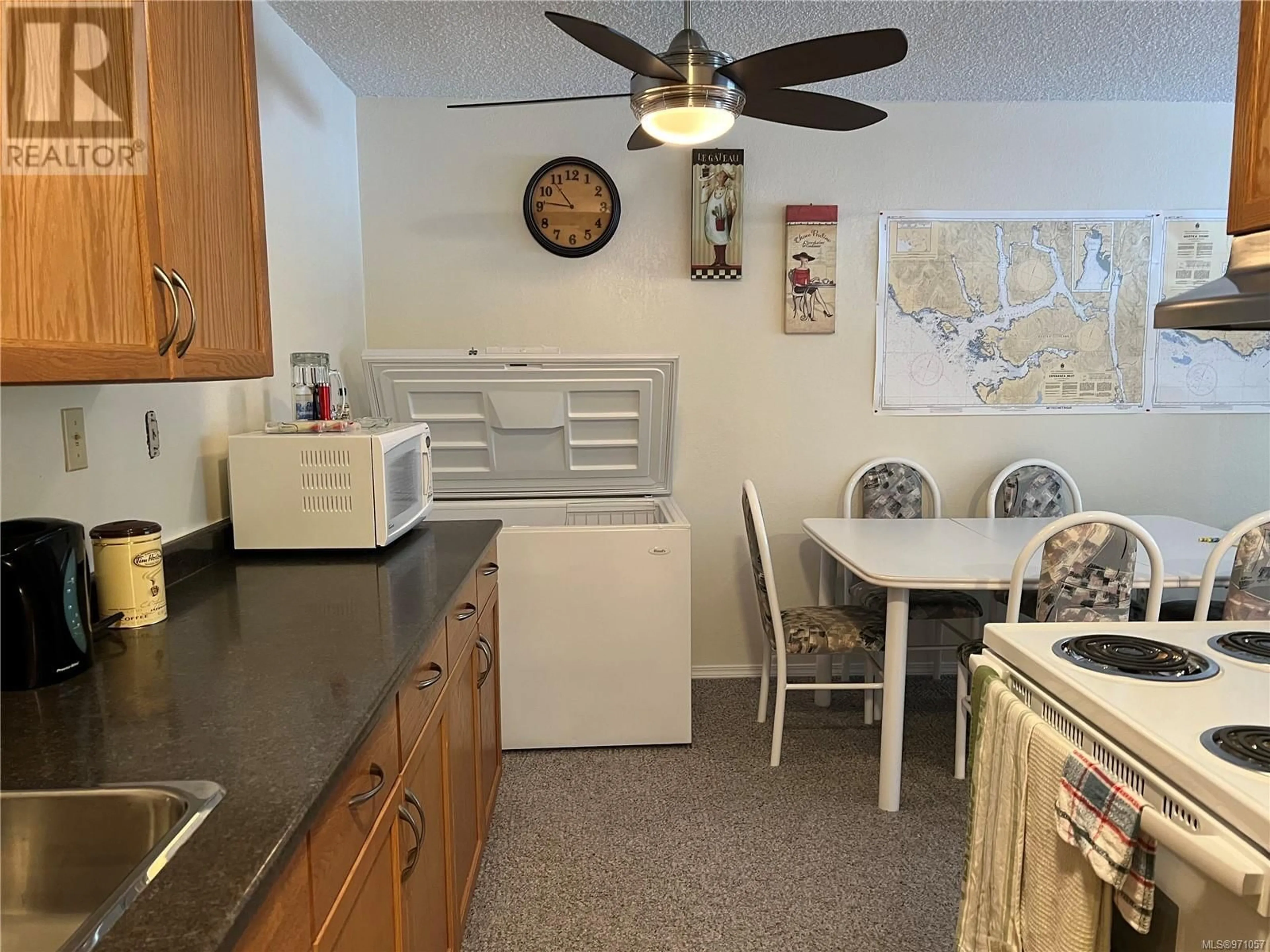 Standard kitchen, wood floors, cottage for 202 651 Maquinna Dr N, Tahsis British Columbia V0P1X0