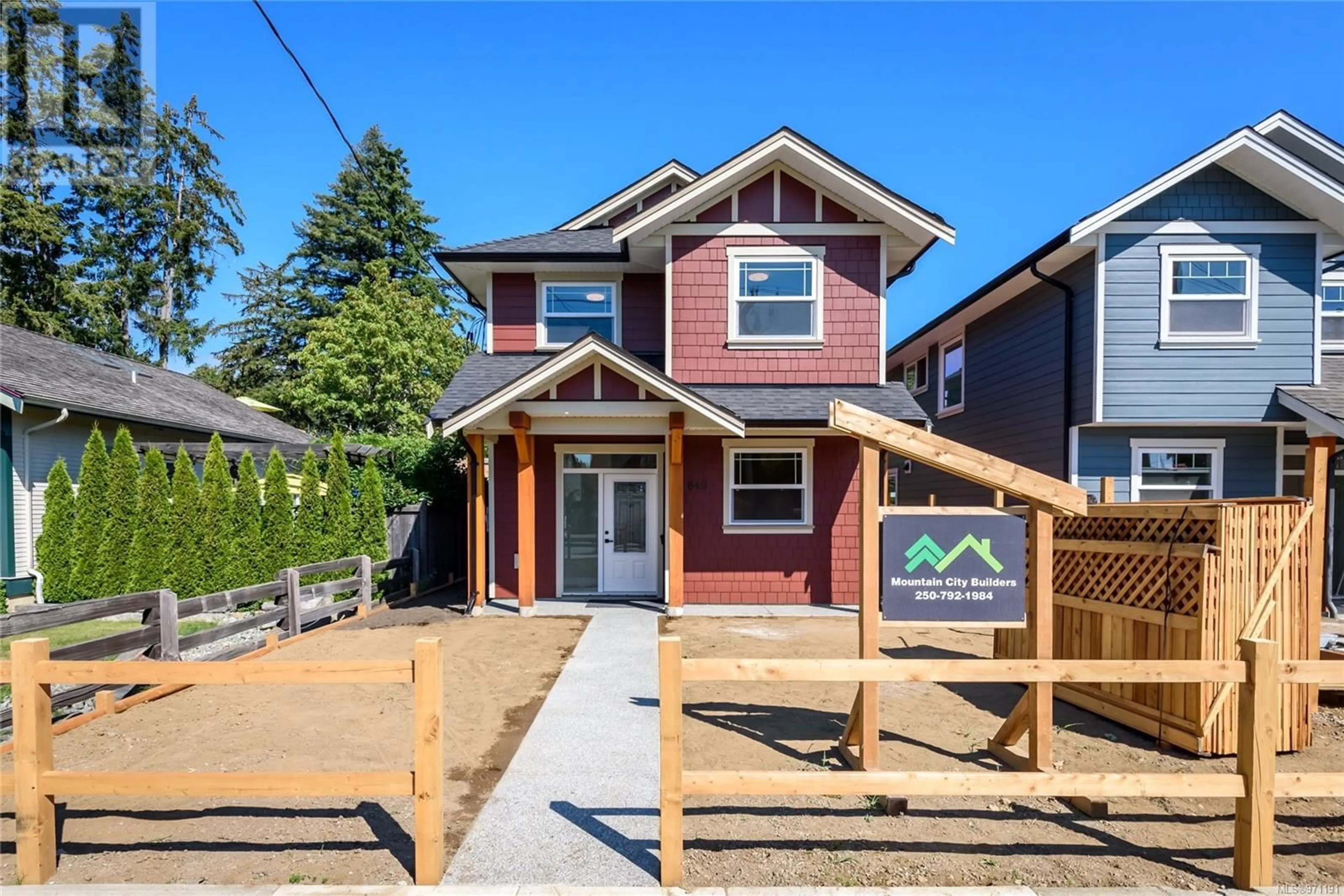 Frontside or backside of a home, the fenced backyard for 649 5th St, Courtenay British Columbia V9N1K5