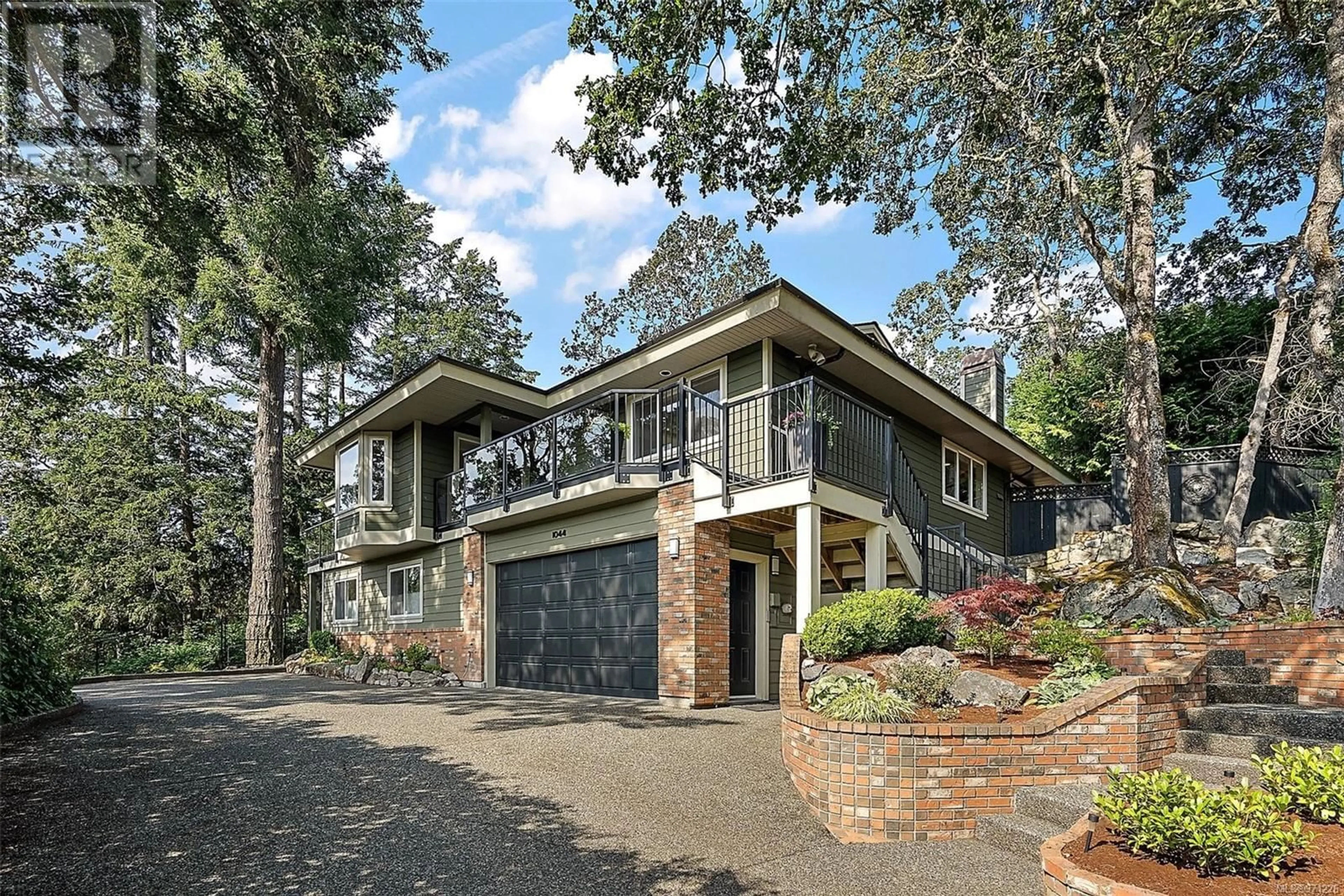 Home with brick exterior material for 1044 Valewood Trail, Saanich British Columbia V8X5G7