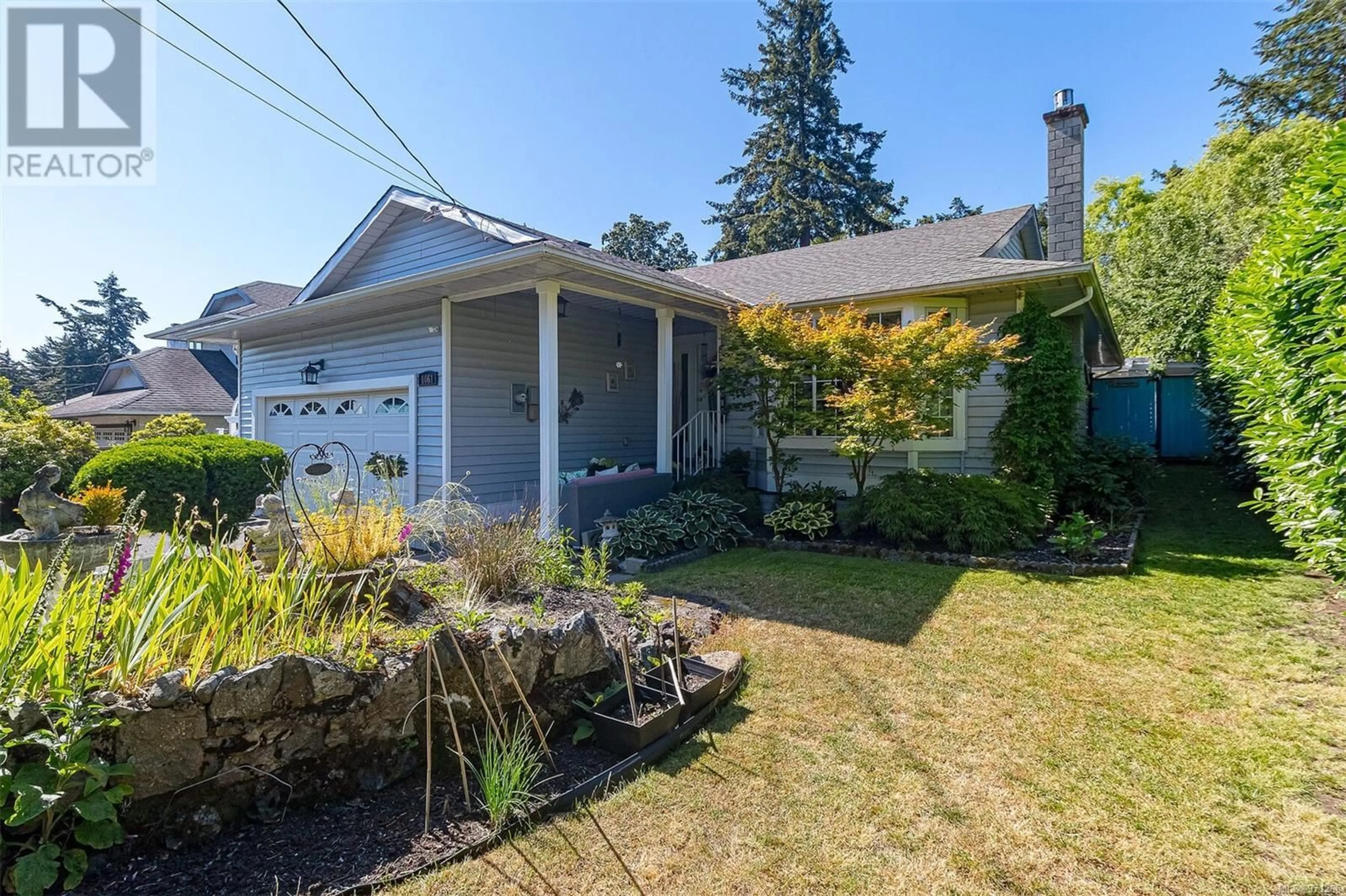 Frontside or backside of a home for 1061 Tulip Ave, Saanich British Columbia V8Z2R1