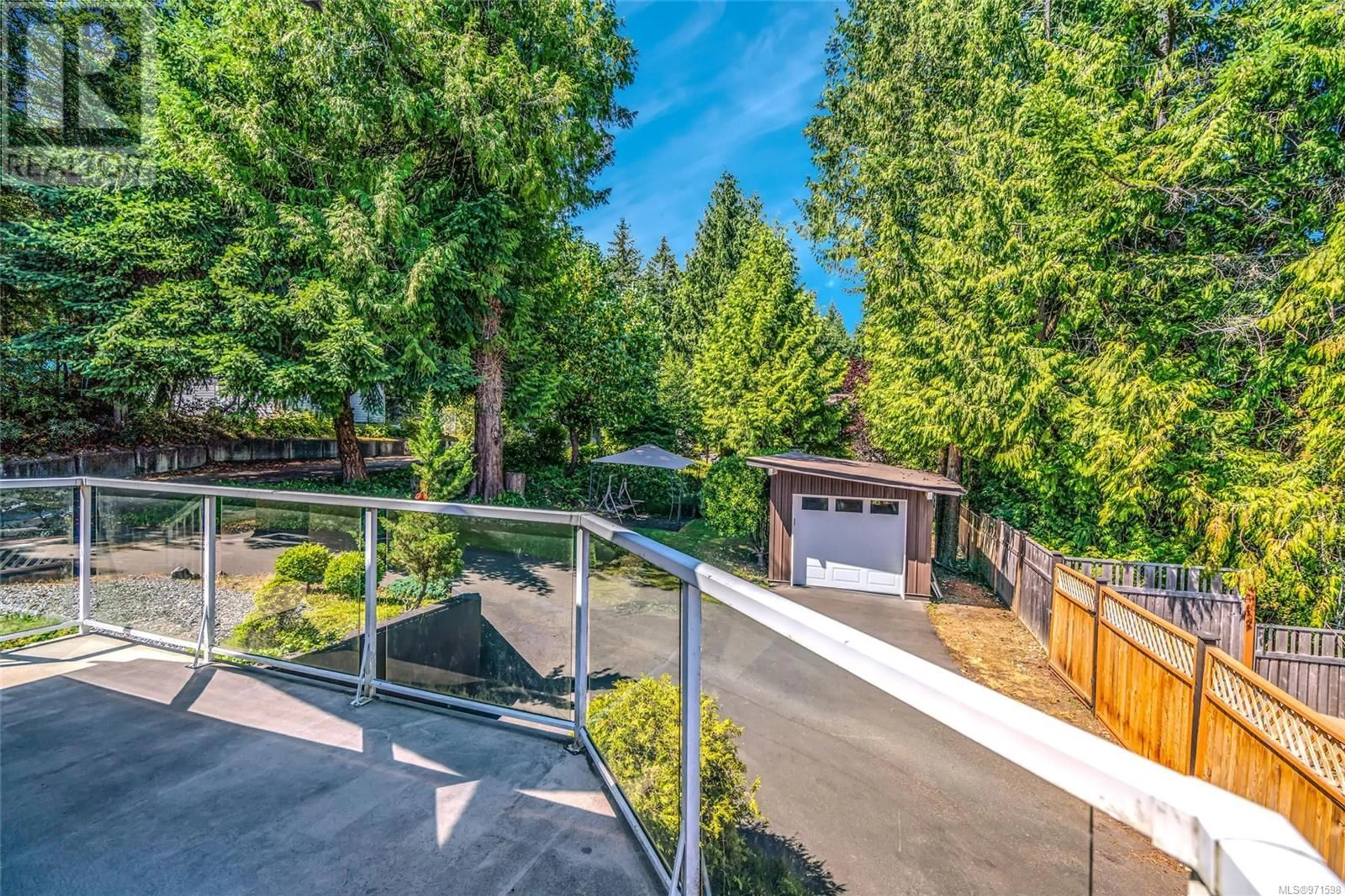 Patio, the fenced backyard for 579 Beach Rd, Qualicum Beach British Columbia V9K1K7