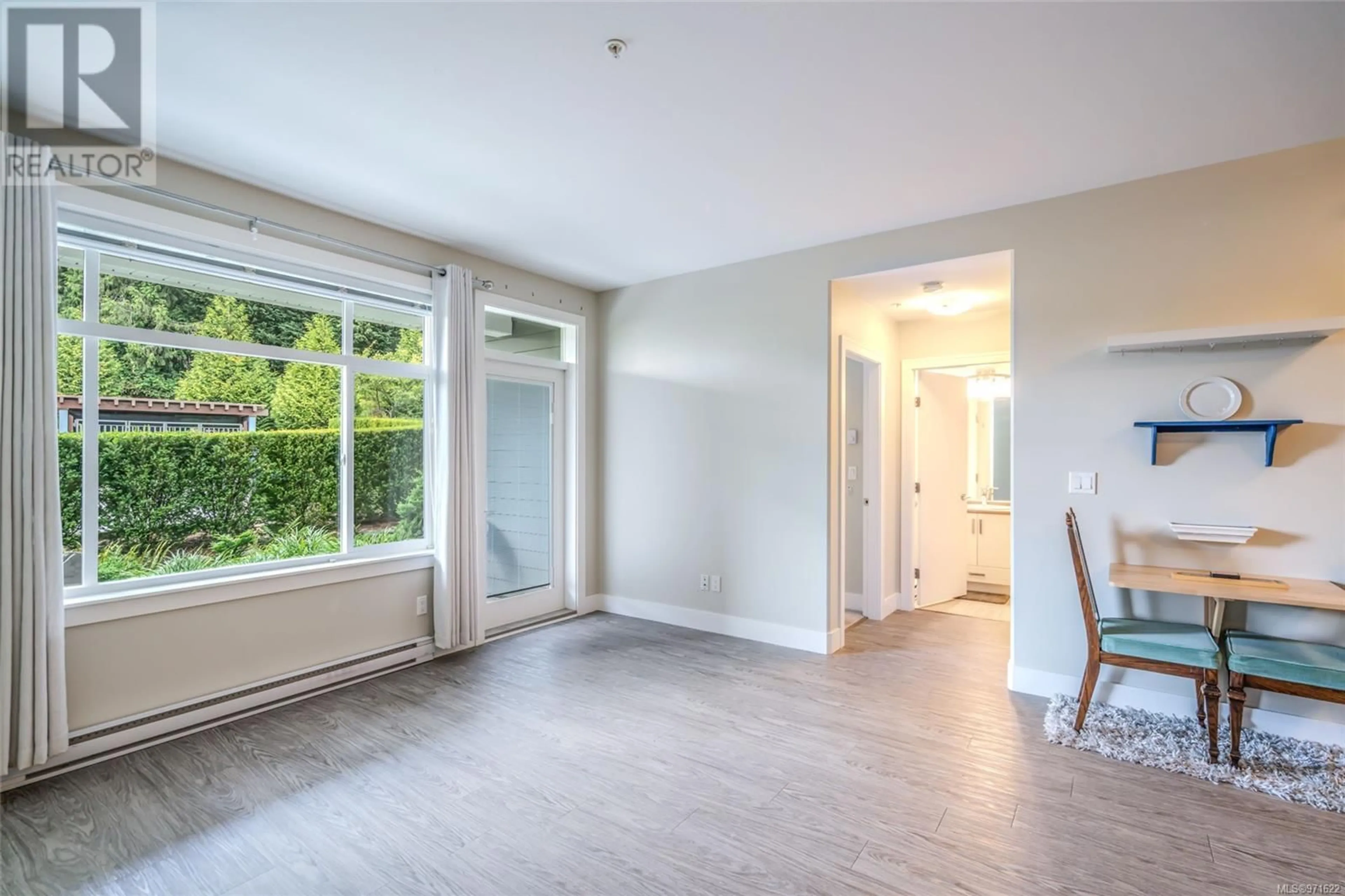 A pic of a room, wood floors for 105 4960 Songbird Pl, Nanaimo British Columbia V9T0H7