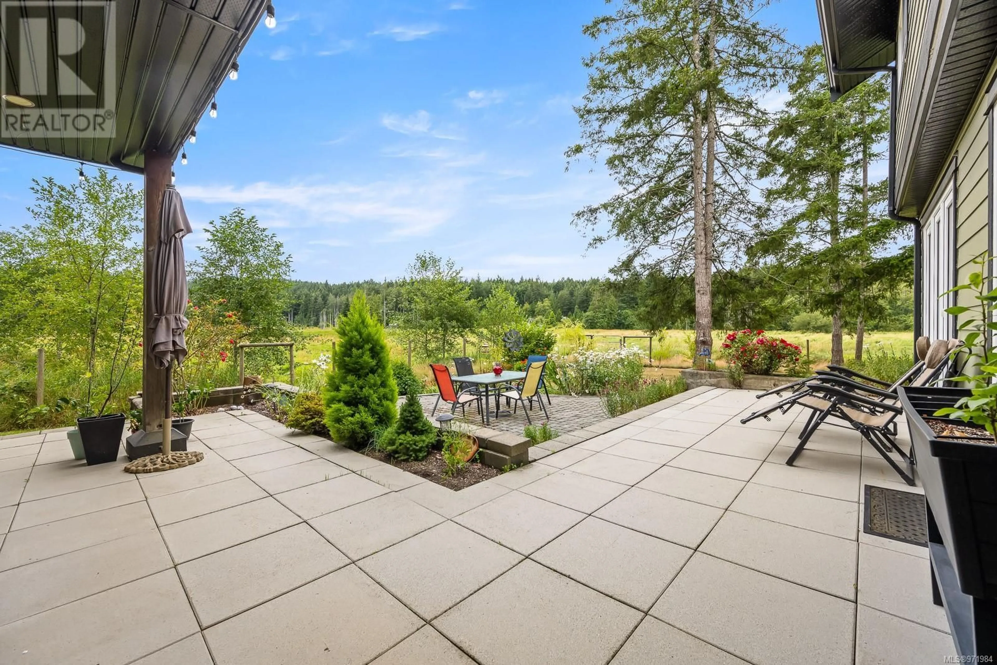 Patio, the fenced backyard for 4101 Beaver Dr, Denman Island British Columbia V0R1T0