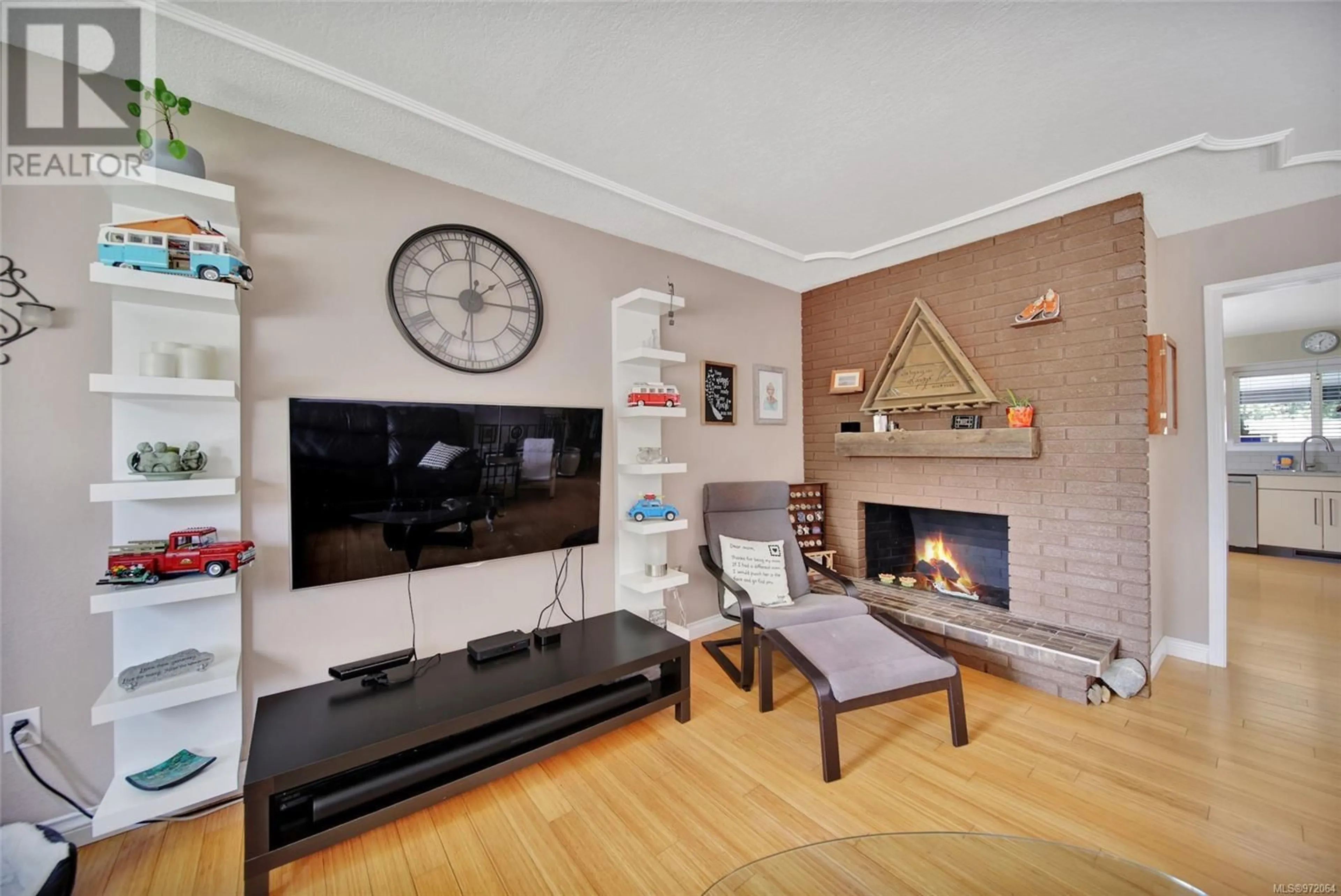 Living room with furniture, wood/laminate floor for 2748 Scafe Rd, Langford British Columbia V9B3W7