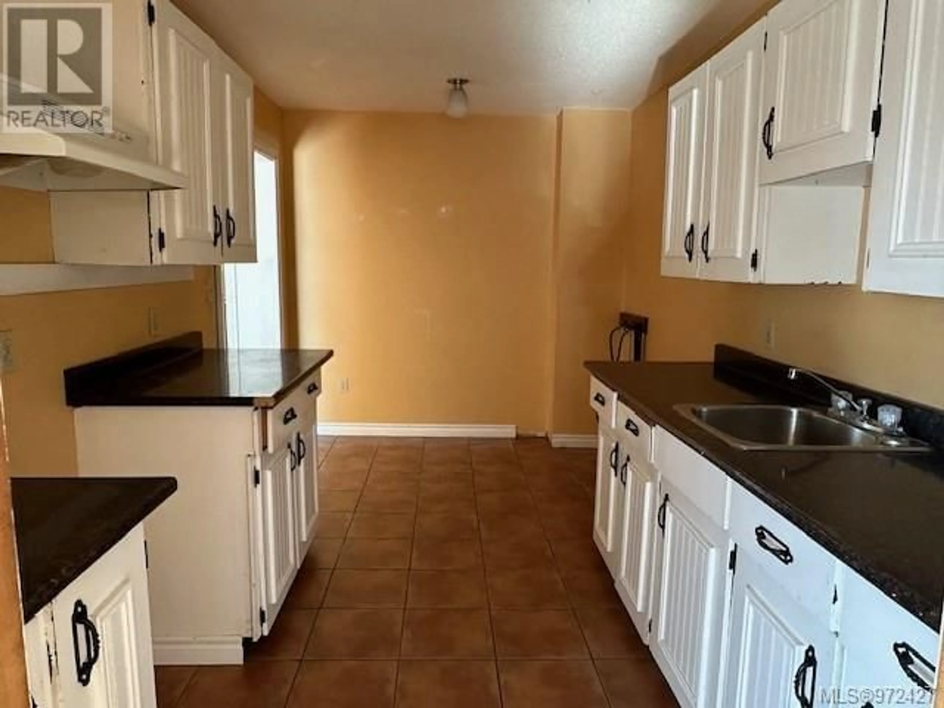 Standard kitchen, wood floors, cottage for 208 7450 Rupert St, Port Hardy British Columbia V0N2P0