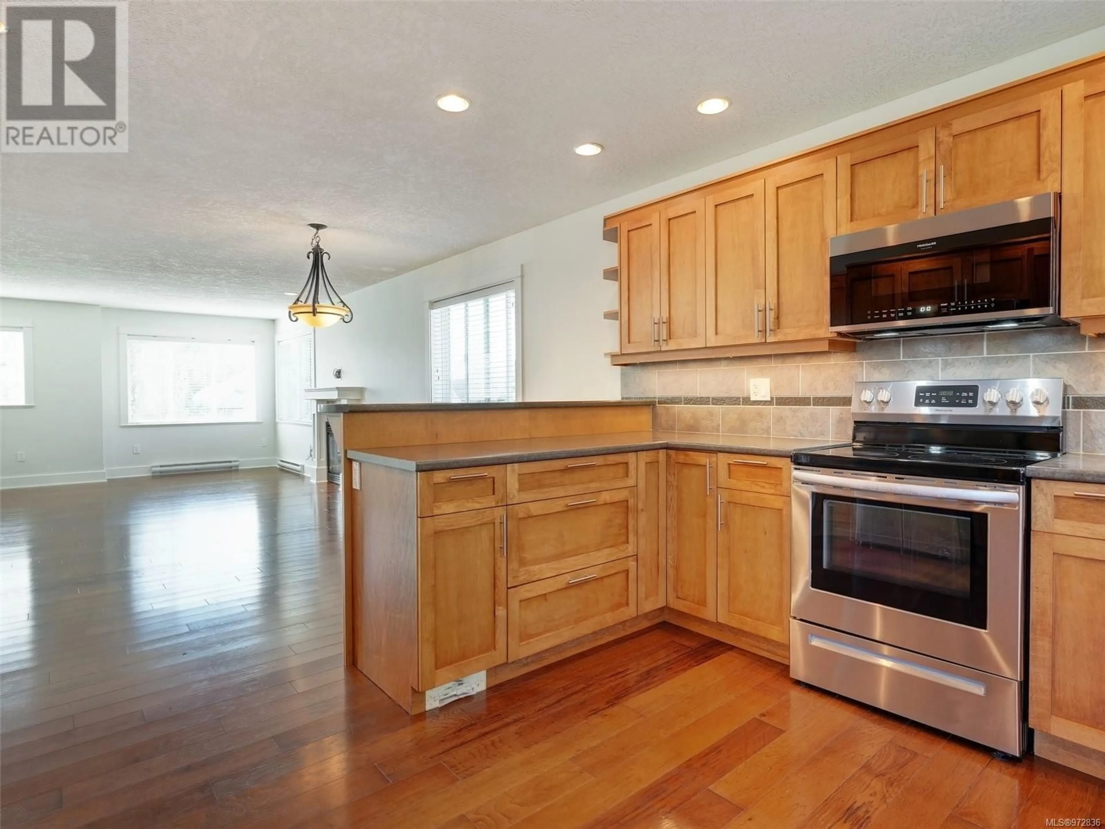 Open concept kitchen for 6990 Brailsford Pl, Sooke British Columbia V9Z1J7