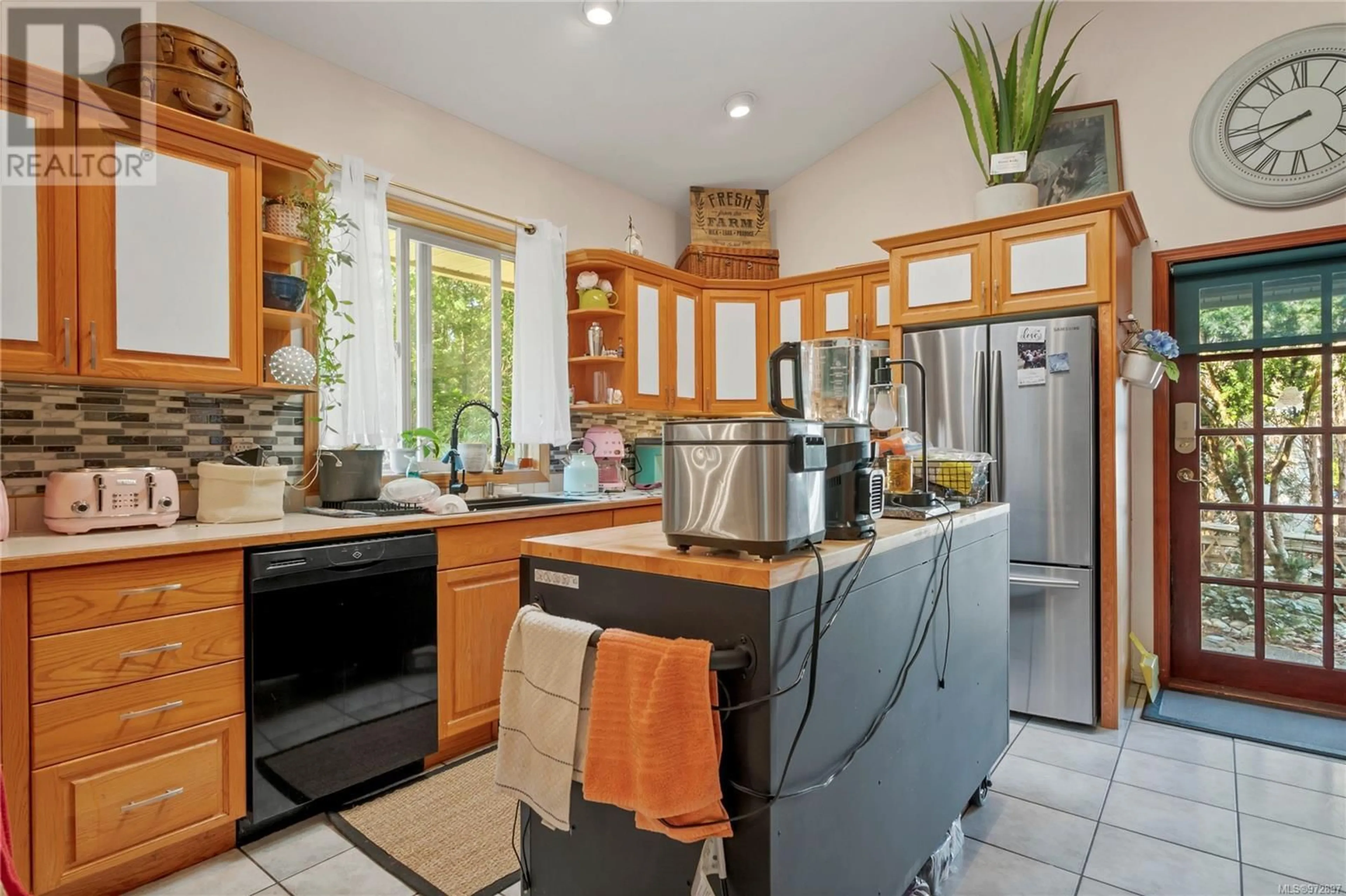 Kitchen, wood floors, cottage for 8856 McLarey Ave, Black Creek British Columbia V9J1A3