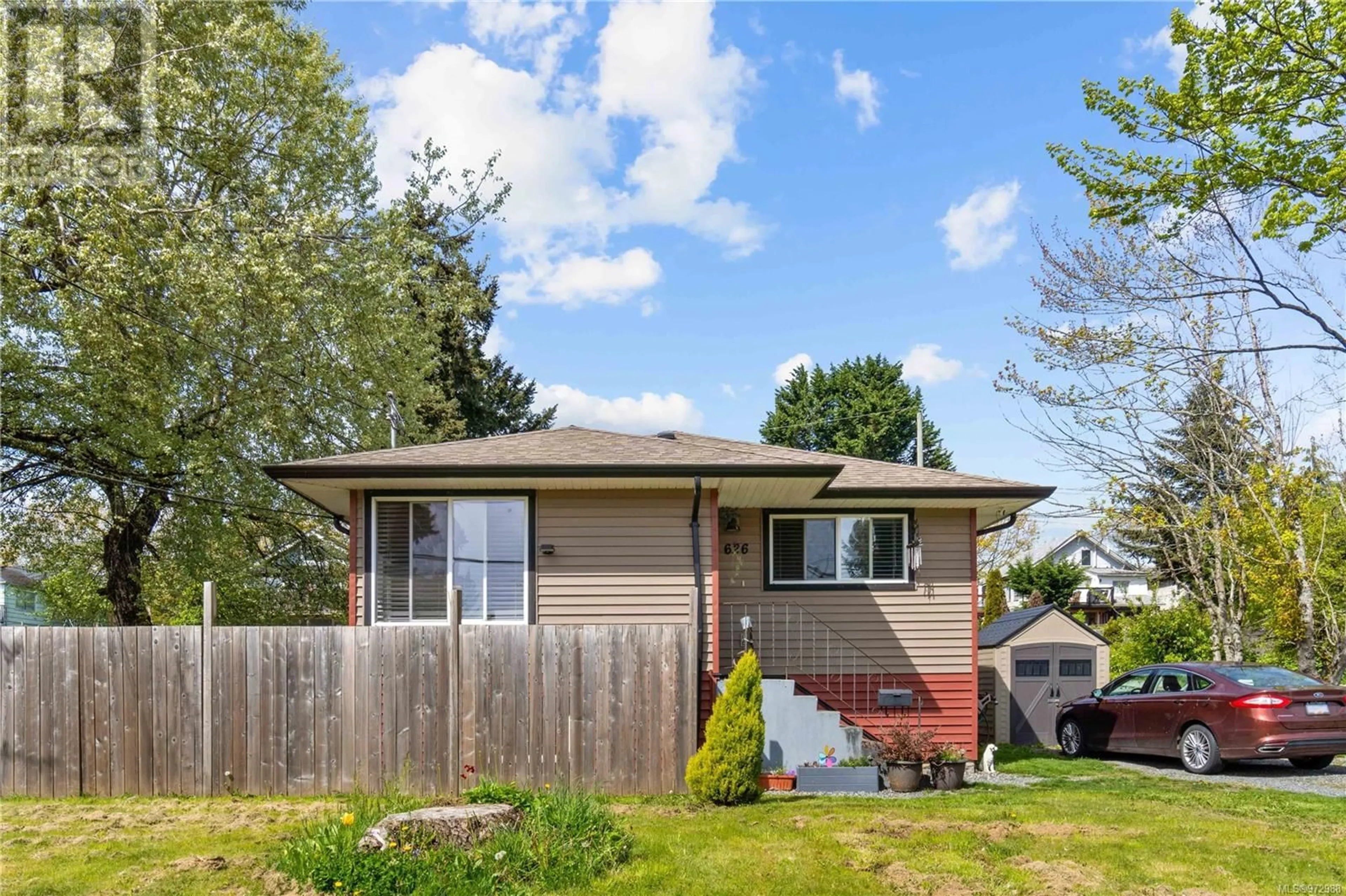 Frontside or backside of a home, the fenced backyard for 626 Haliburton St, Nanaimo British Columbia V9R4W5