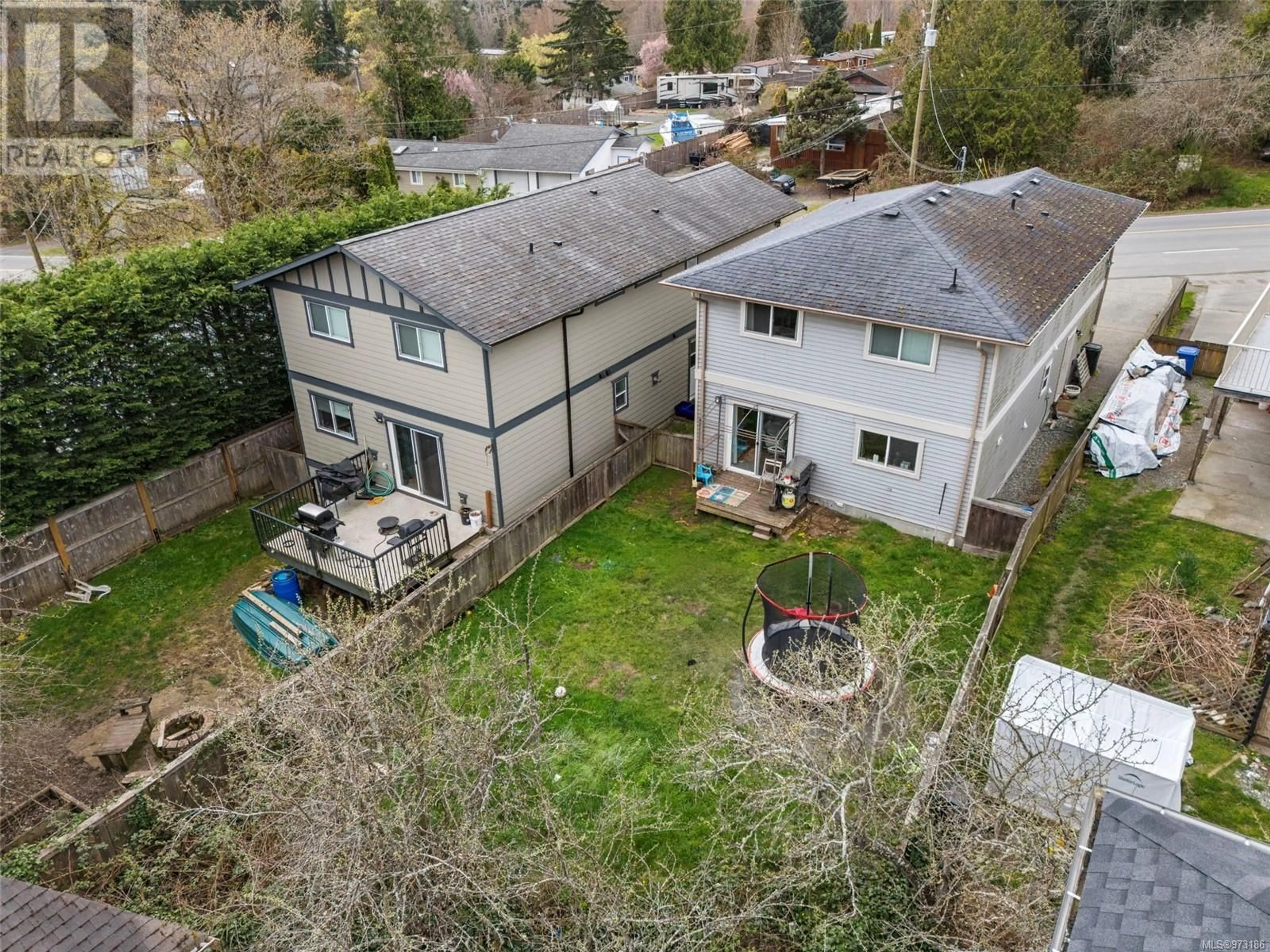 Frontside or backside of a home, the fenced backyard for 2095 Maple Ave S, Sooke British Columbia V9Z0N8