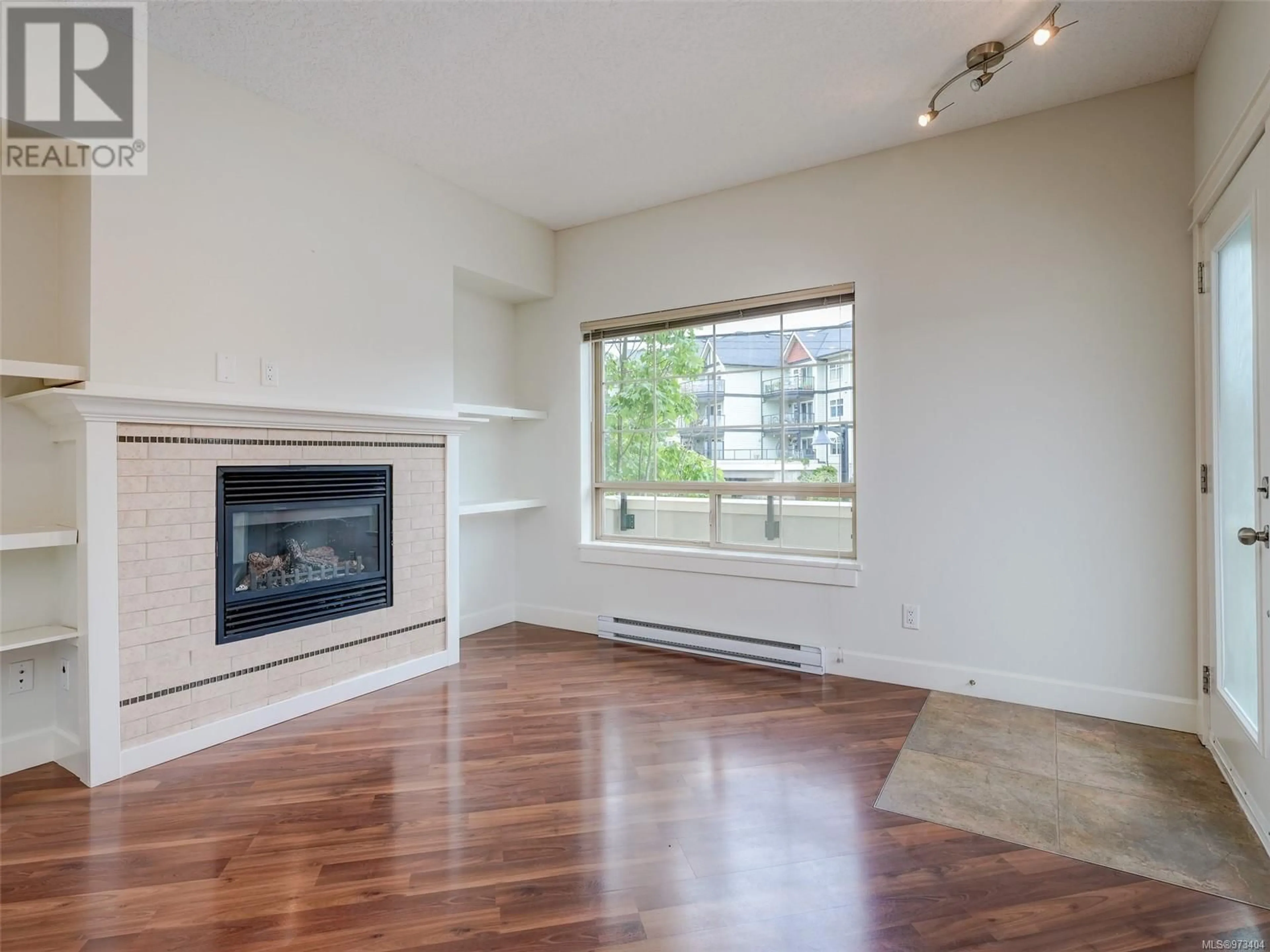 Living room, wood floors for 201 785 Station Ave, Langford British Columbia V9B0E6