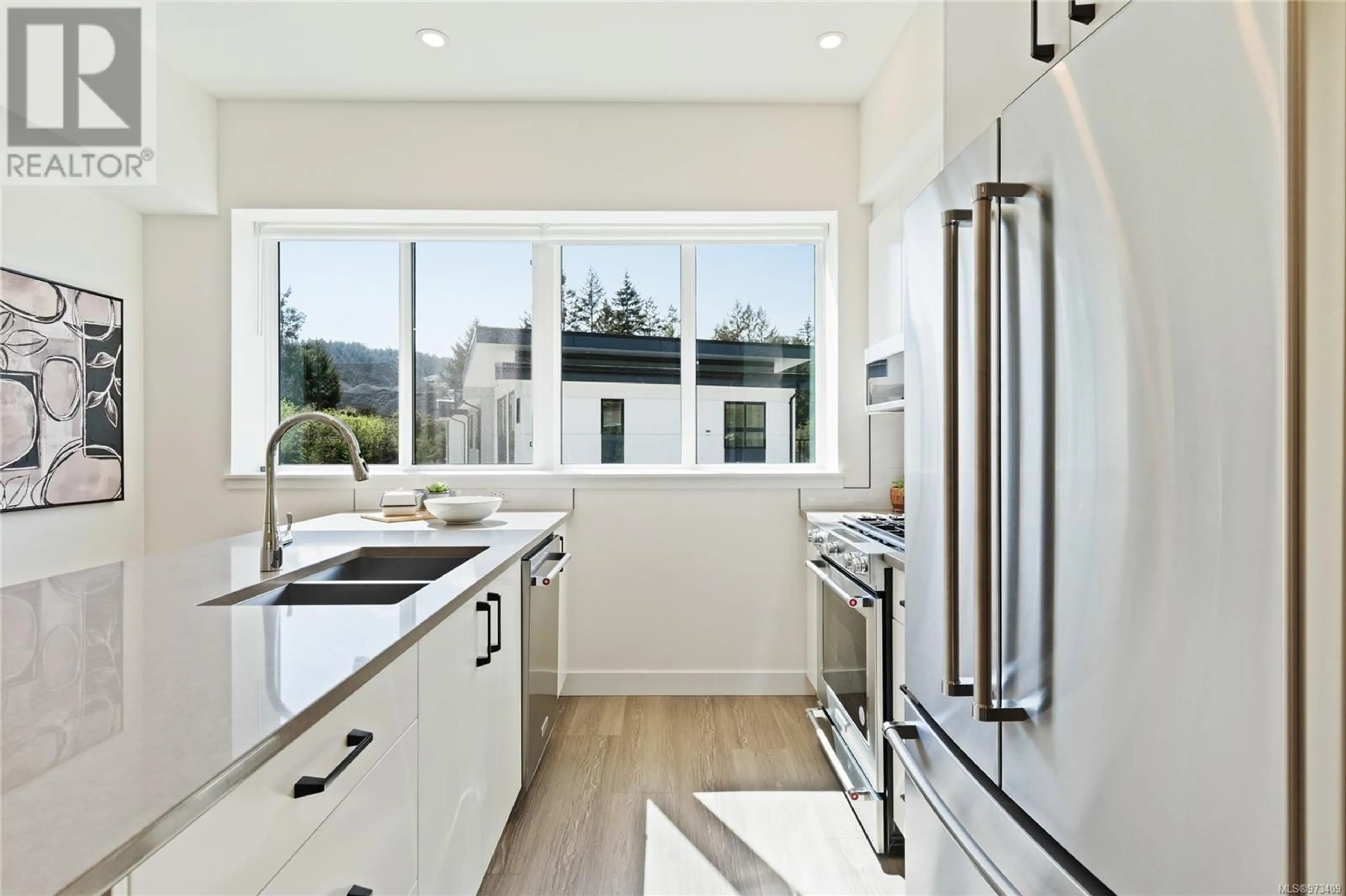 Contemporary kitchen, wood floors, mountain for 2821 Caster Pl, Langford British Columbia V9B0B2