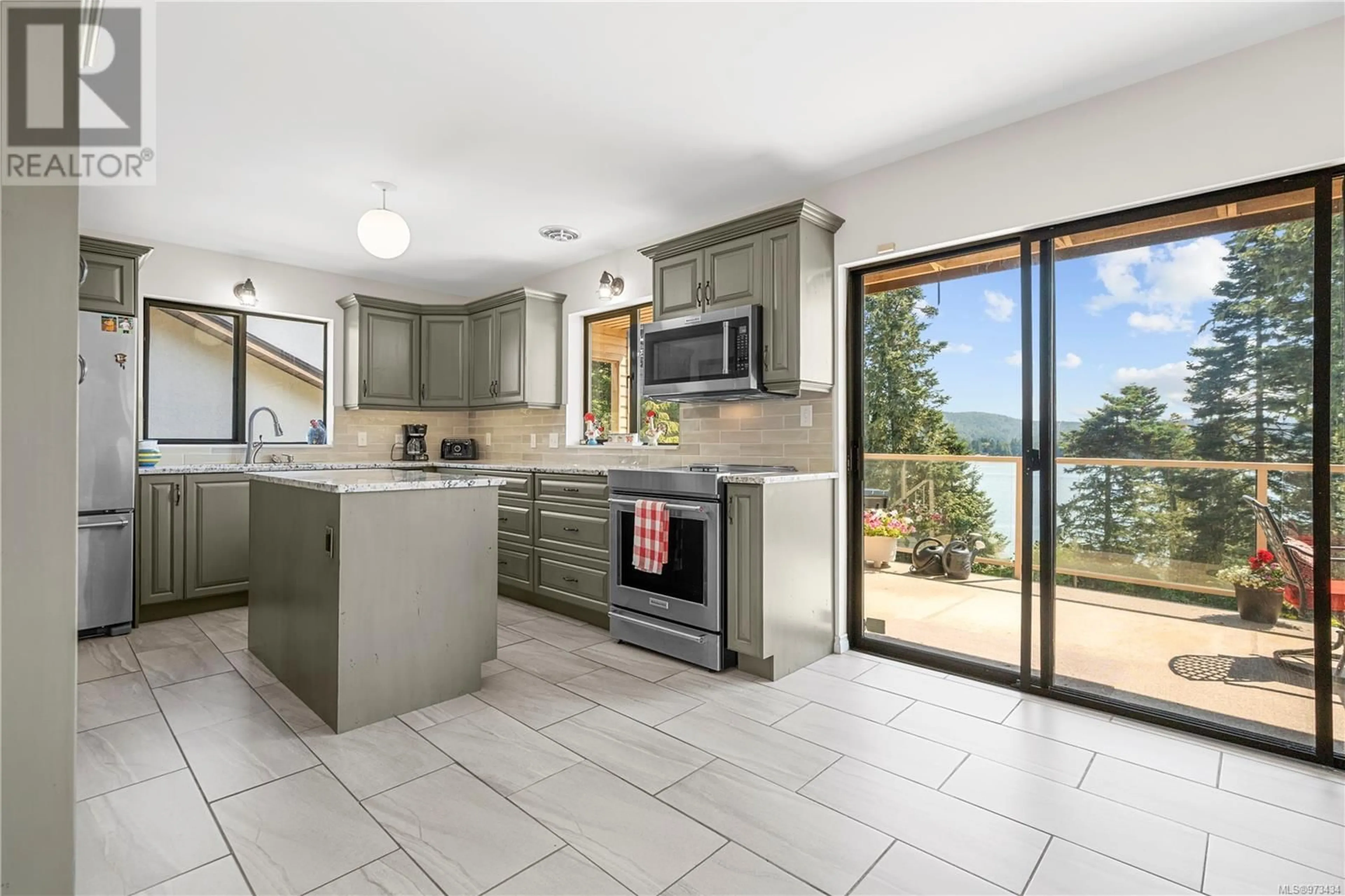 Open concept kitchen for 6713 Horne Rd, Sooke British Columbia V9Z1H9