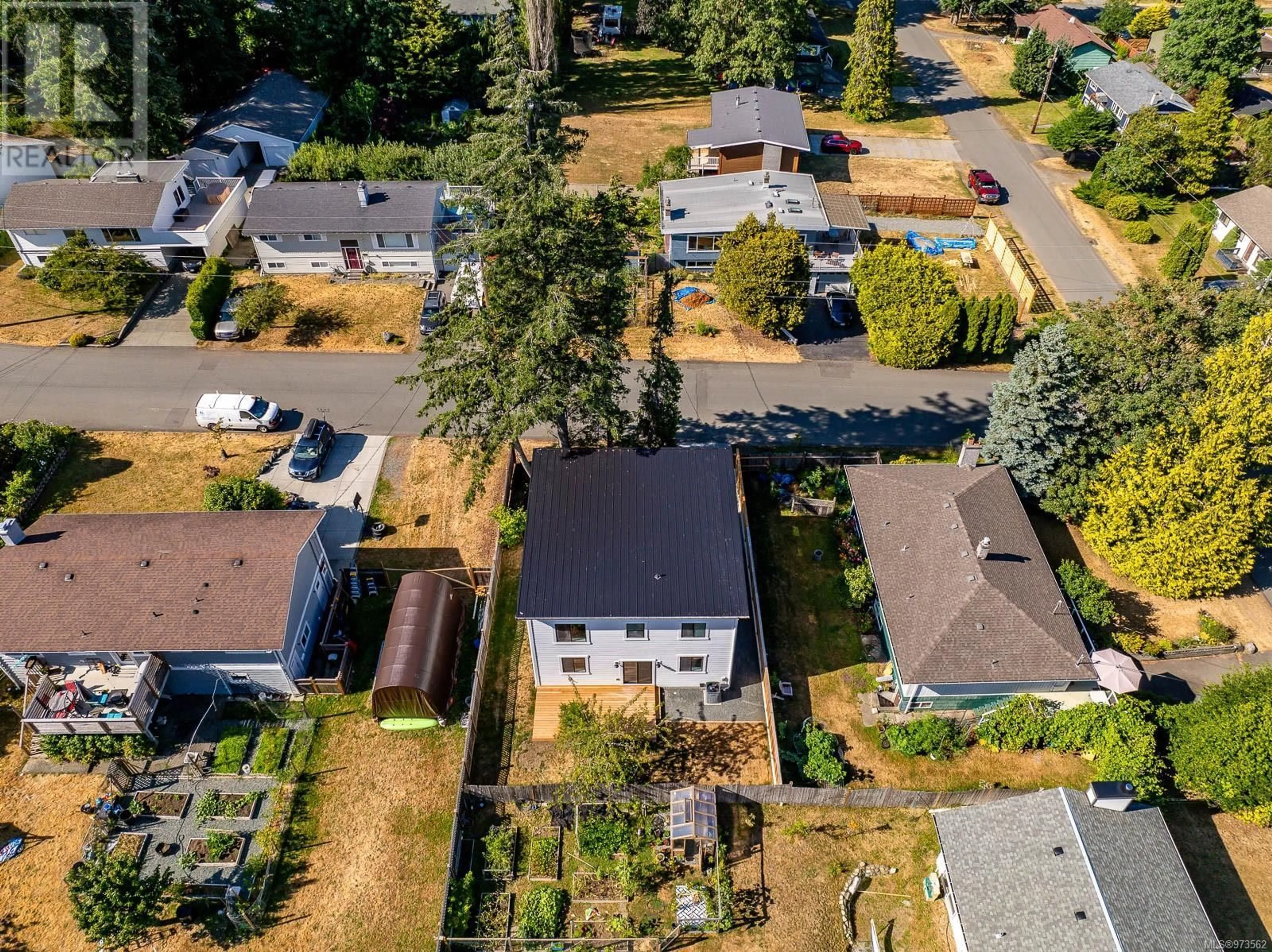 Frontside or backside of a home, the fenced backyard for 1635 Dogwood Ave, Comox British Columbia V9M2W8