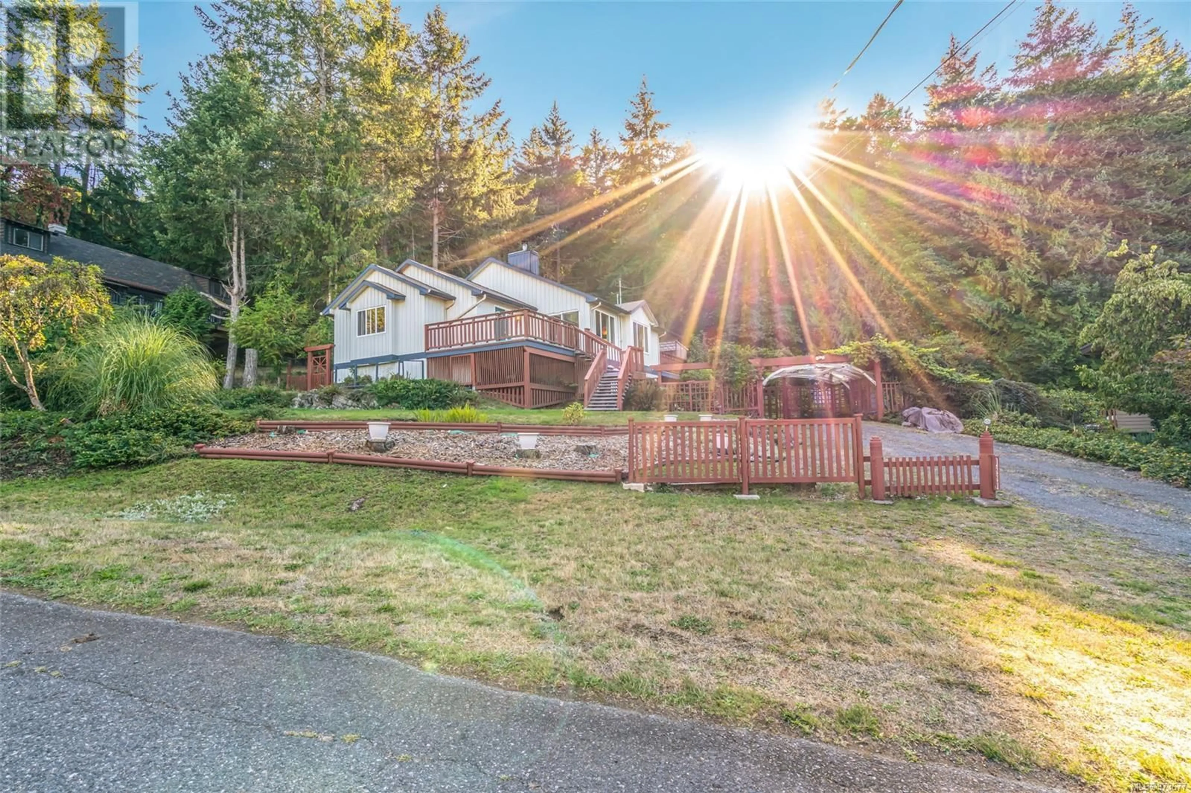 A pic from exterior of the house or condo, the fenced backyard for 1887 Sea Lion Cres, Nanoose Bay British Columbia V9P9J3