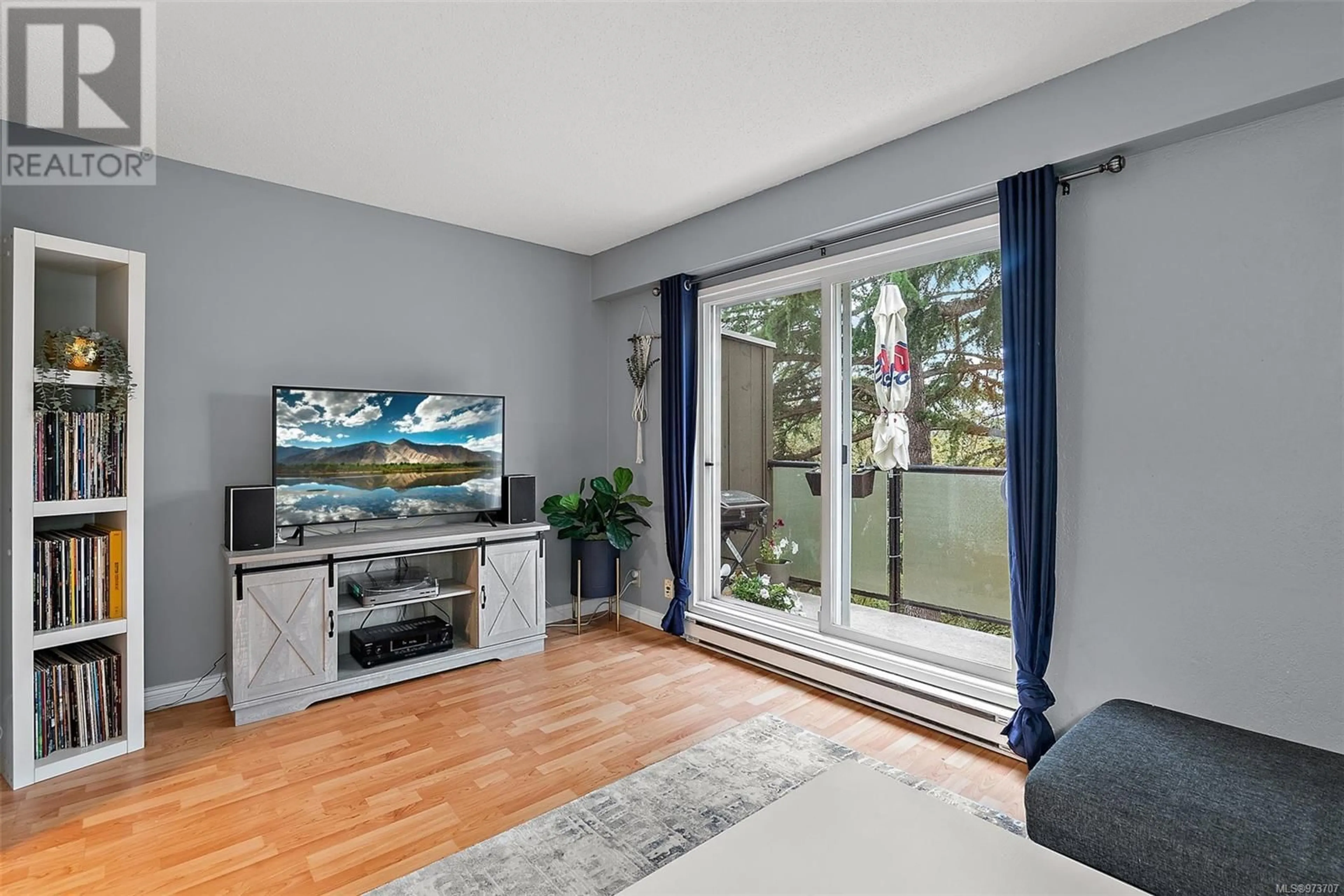 Living room, wood floors for 203 991 Cloverdale Ave, Saanich British Columbia V8X2T5