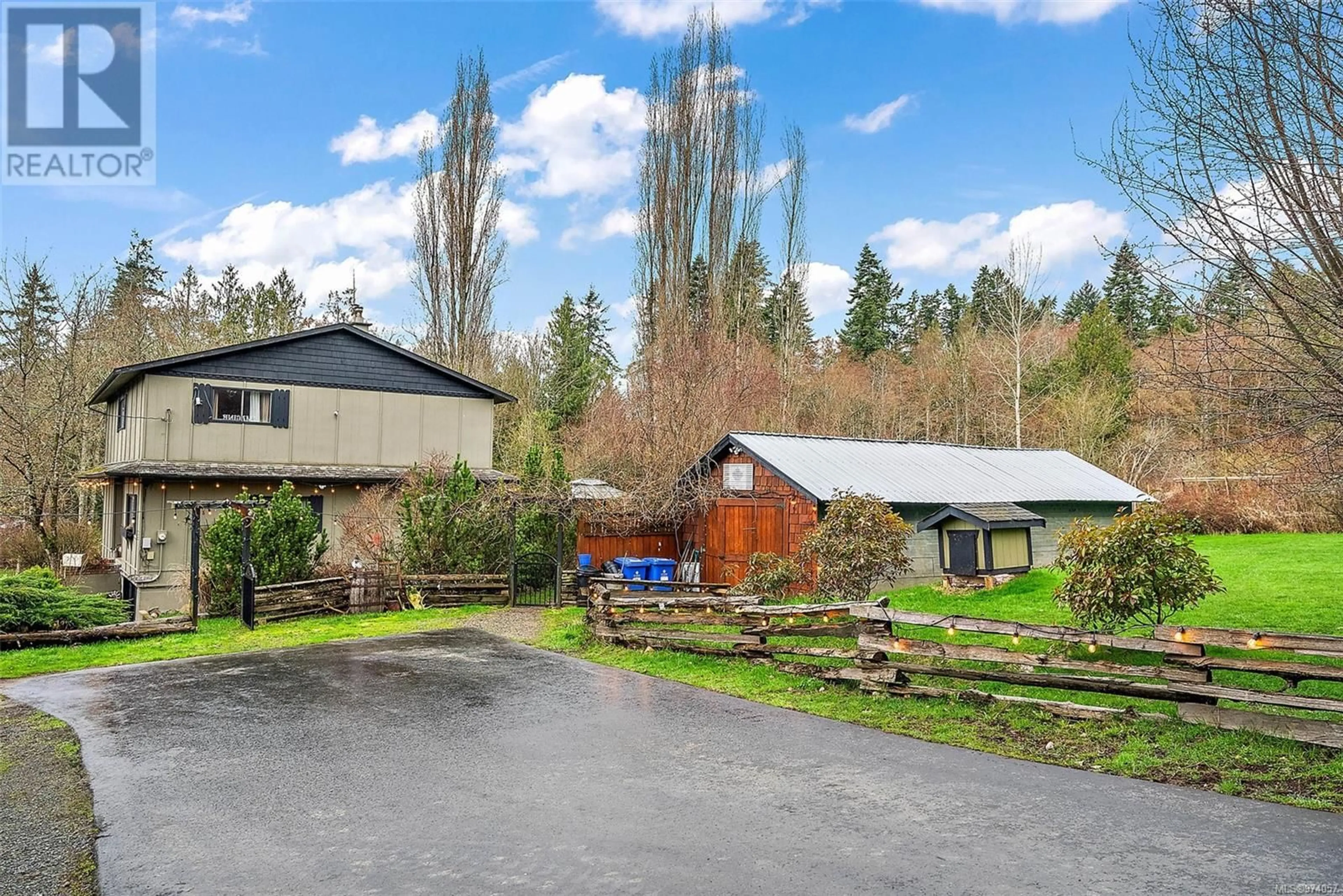 A pic from exterior of the house or condo, the fenced backyard for 2940 Horton Rd, Mill Bay British Columbia V0R2P3