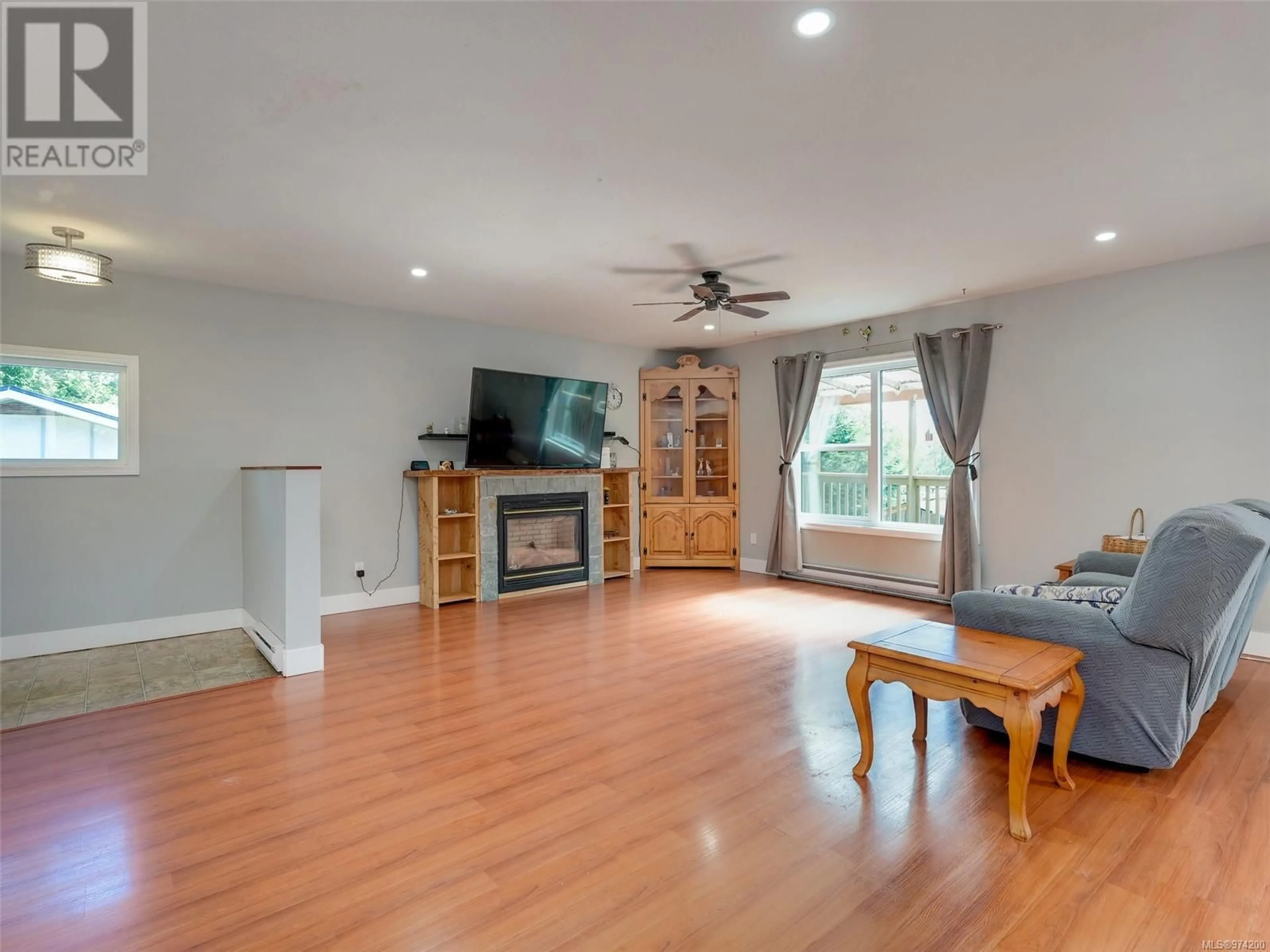 Living room, wood floors for 6943 Grant Rd W, Sooke British Columbia V9Z0P4