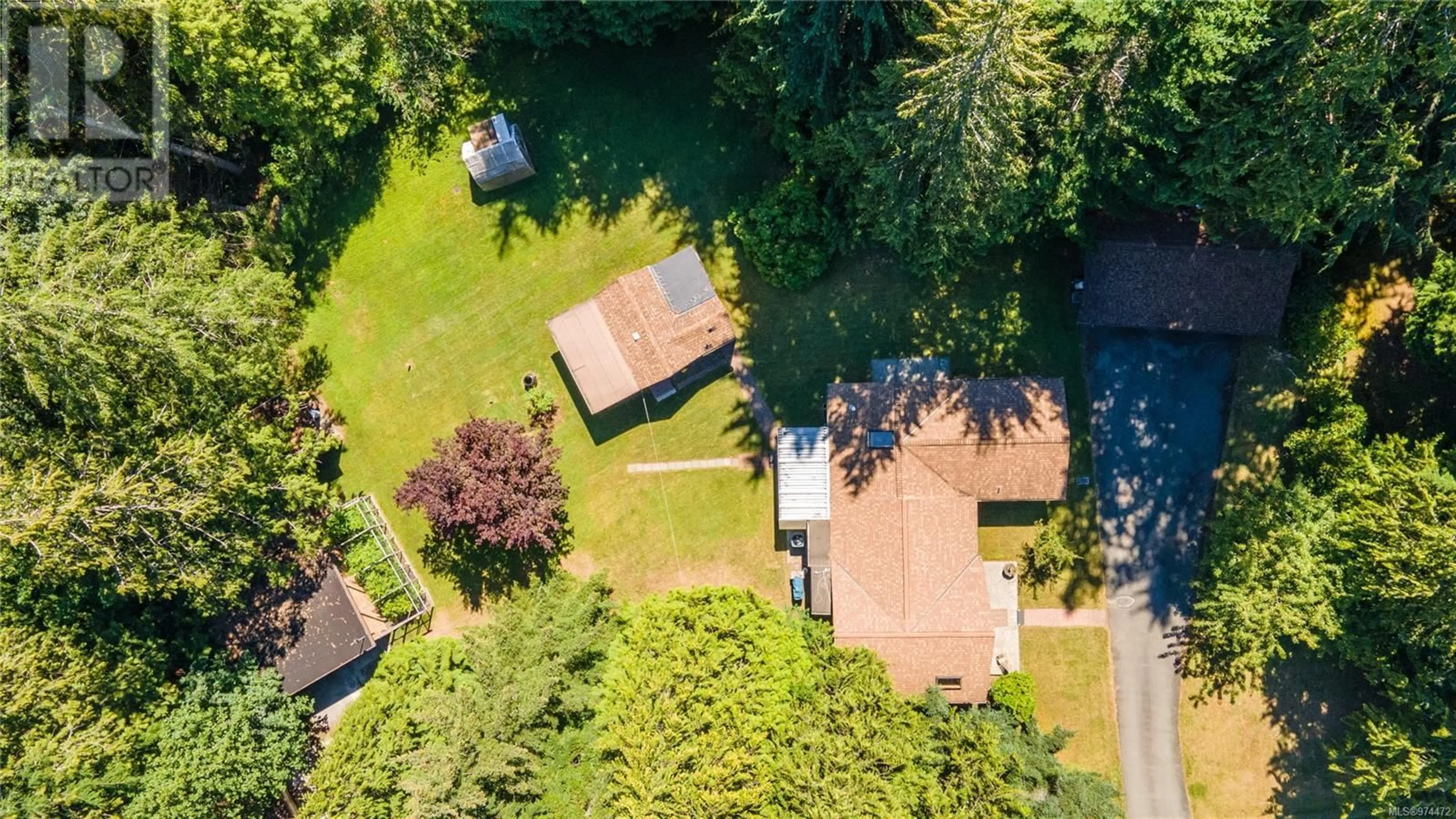 Frontside or backside of a home, the fenced backyard for 3826 CHARLTON Dr, Qualicum Beach British Columbia V9K1Z3