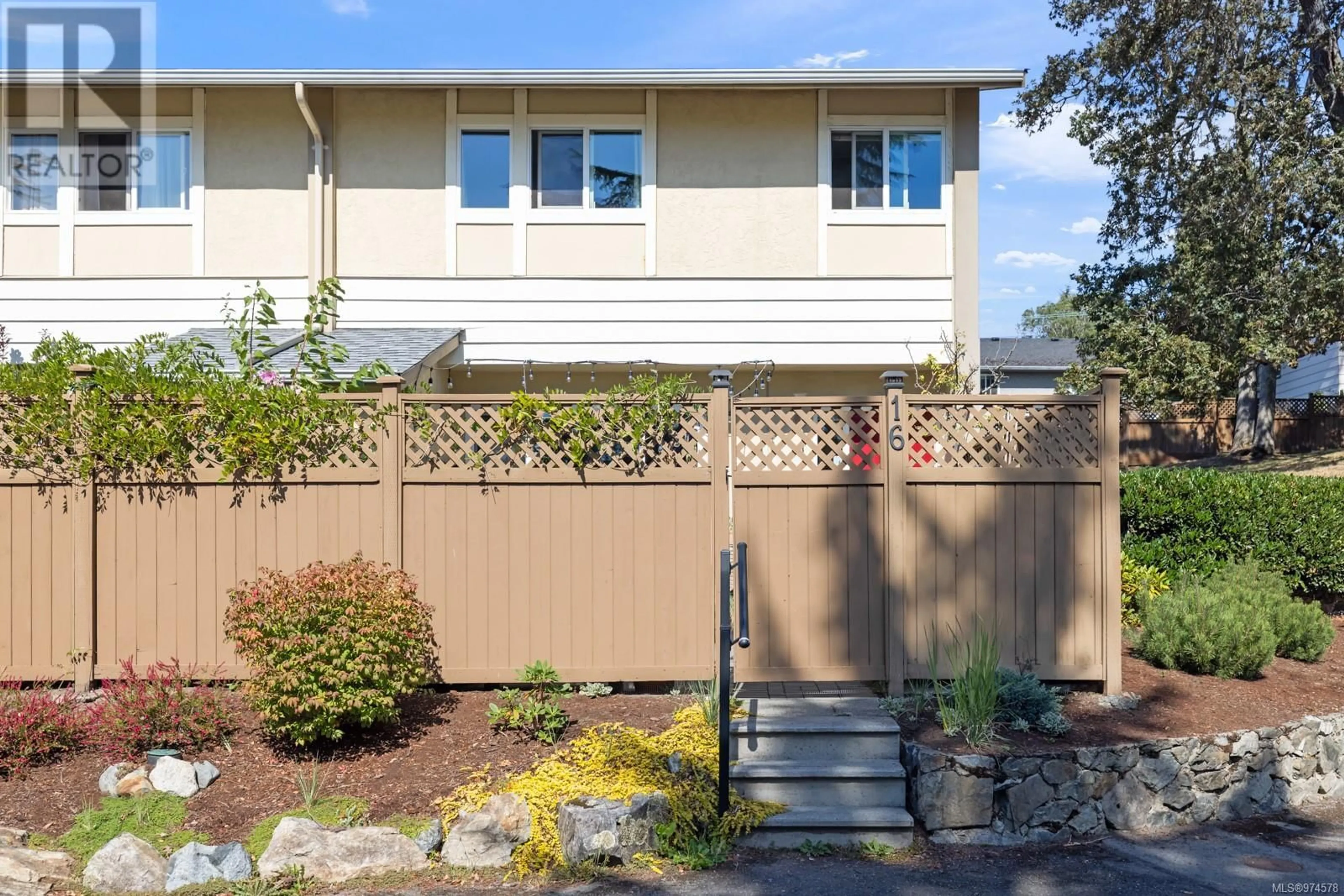 A pic from exterior of the house or condo, the fenced backyard for 16 3981 Nelthorpe St, Saanich British Columbia V8X3Z2