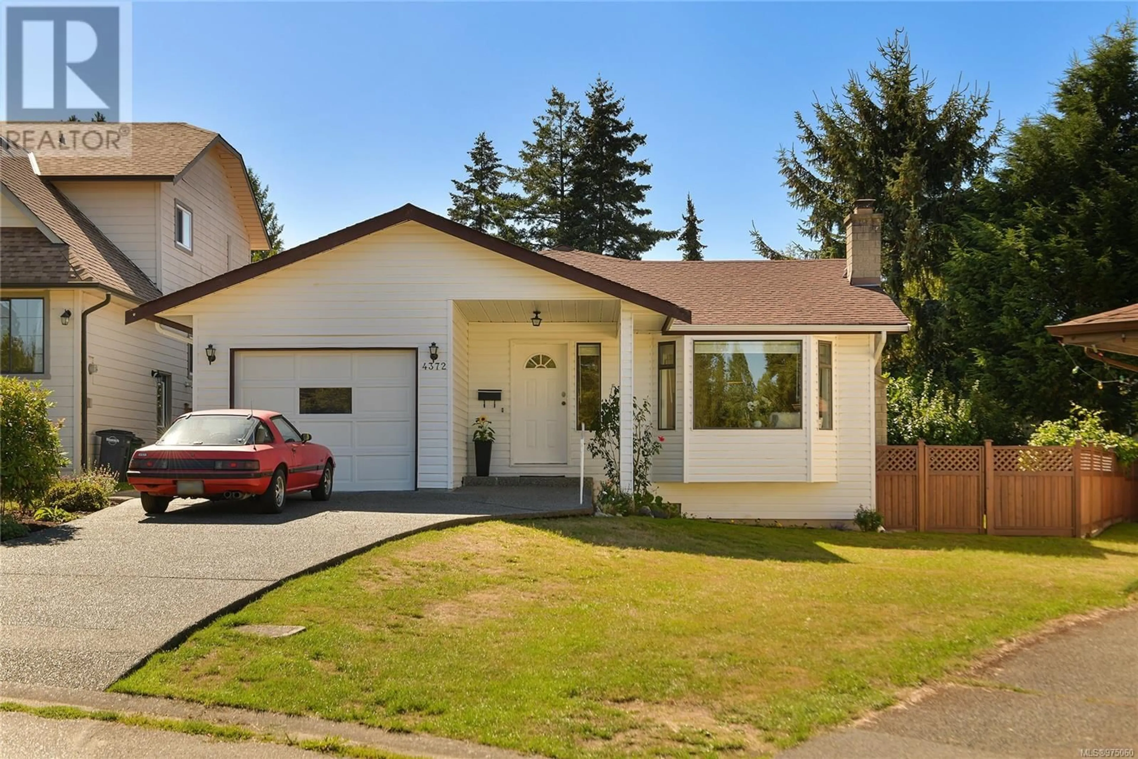 Frontside or backside of a home, the fenced backyard for 4372 Vanguard Pl, Saanich British Columbia V8Z6X3