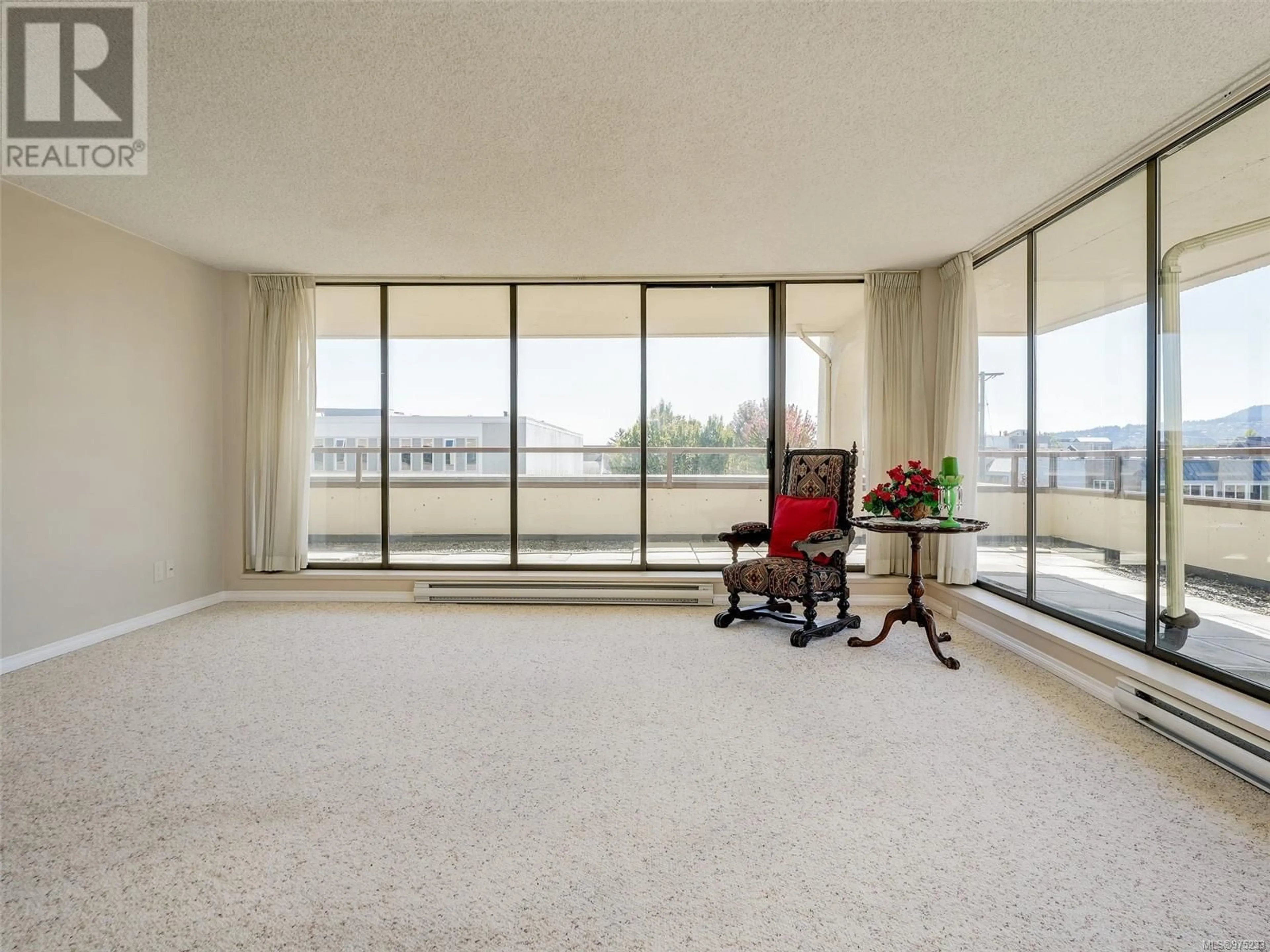 A pic of a room, carpet floors for 204 9805 Second St, Sidney British Columbia V8L4T9