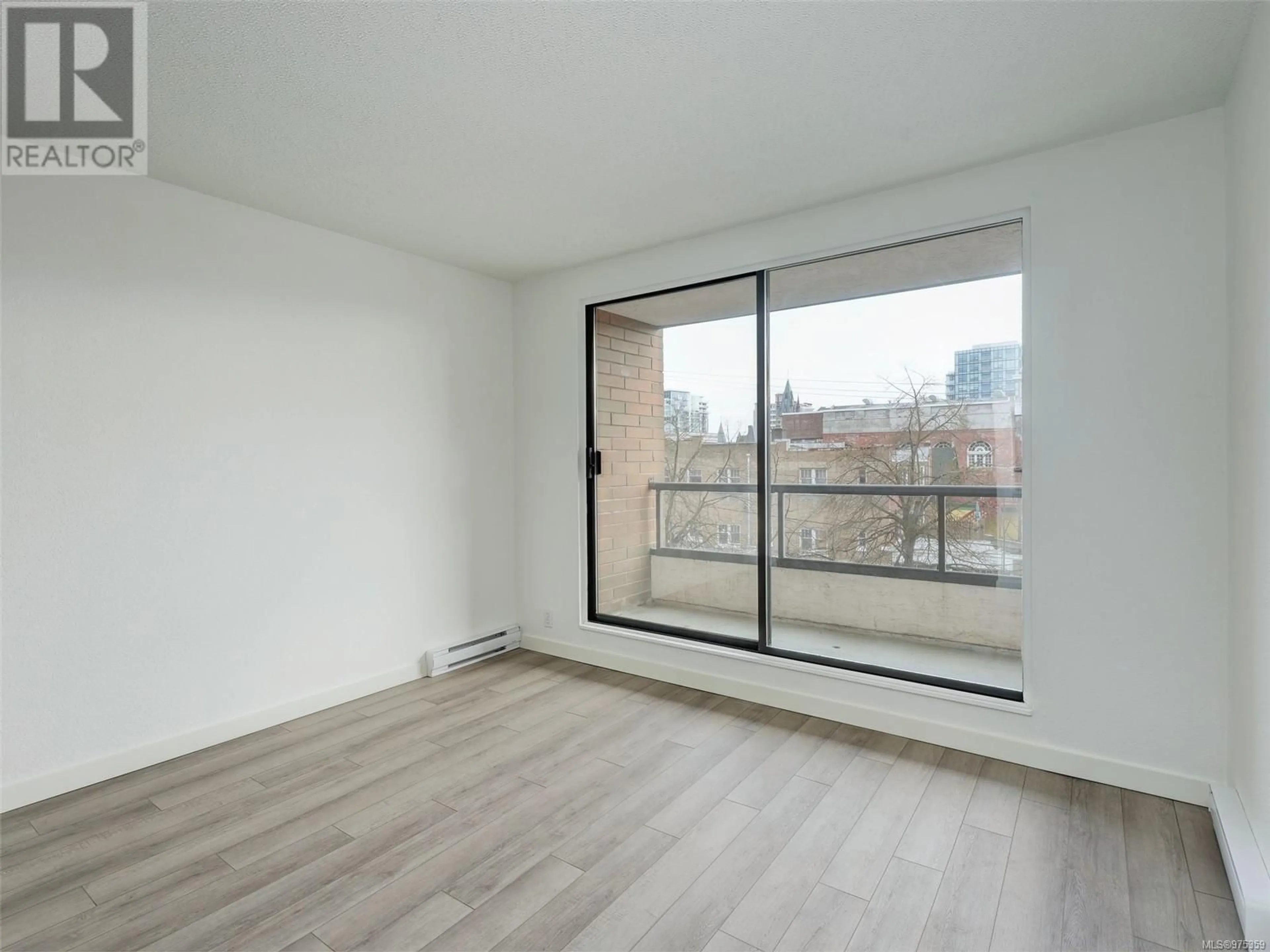 A pic of a room, wood floors for 401 1630 Quadra St, Victoria British Columbia V8W3J5