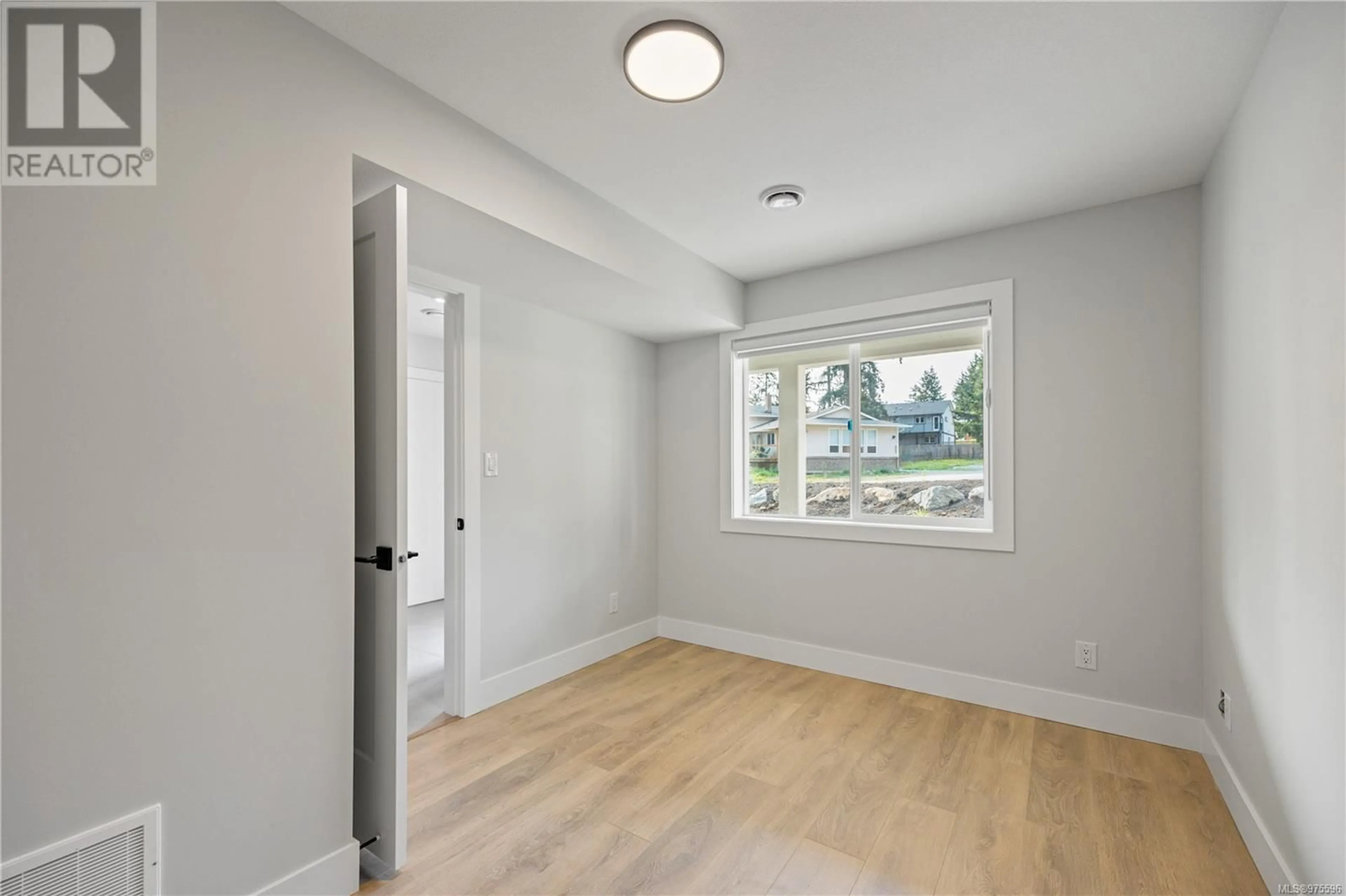 A pic of a room, wood floors for 390 Avaani Way, Nanaimo British Columbia V9R4J5