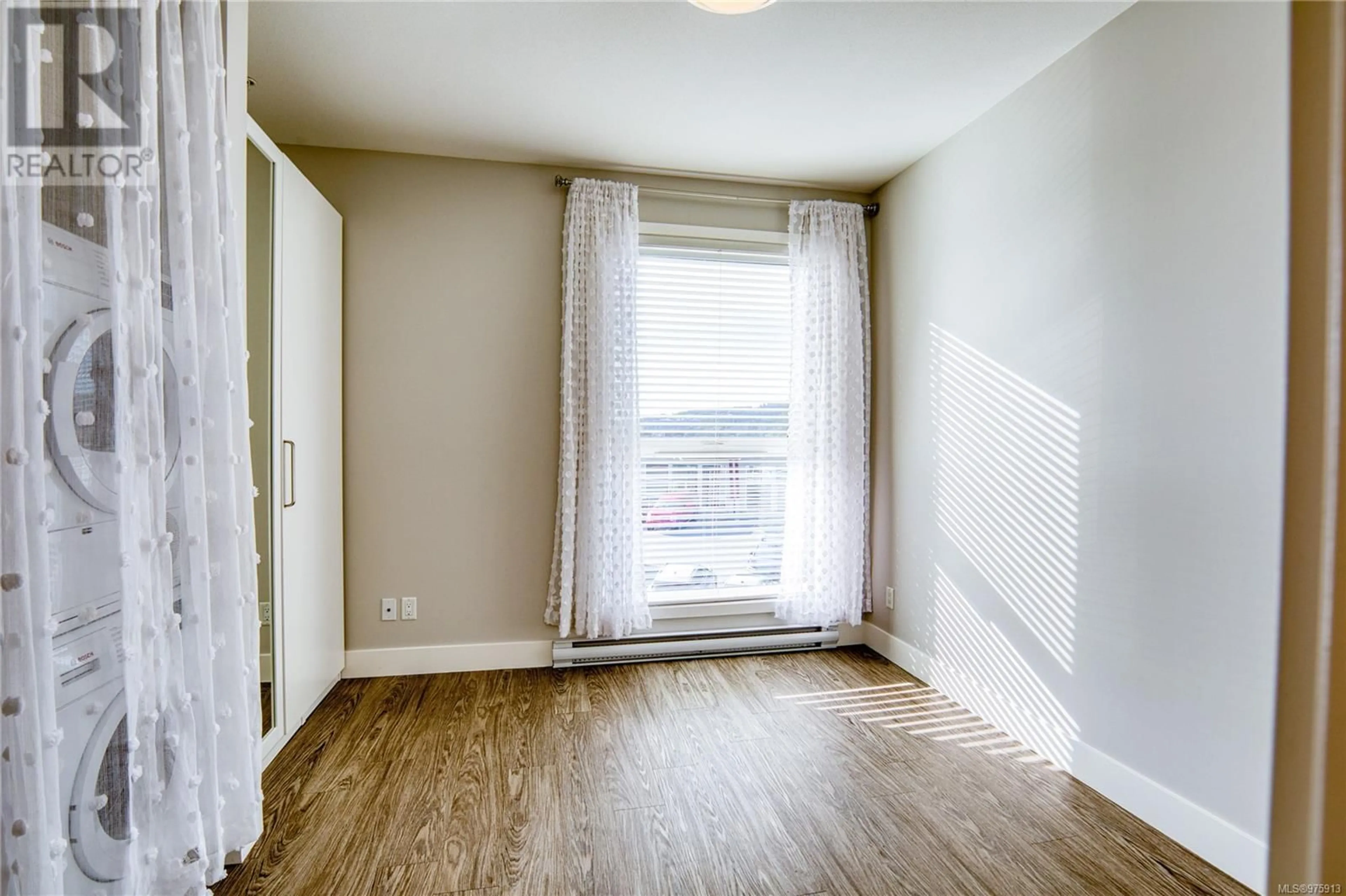 A pic of a room, wood floors for 205 1847 Dufferin Cres, Nanaimo British Columbia V9S0B1