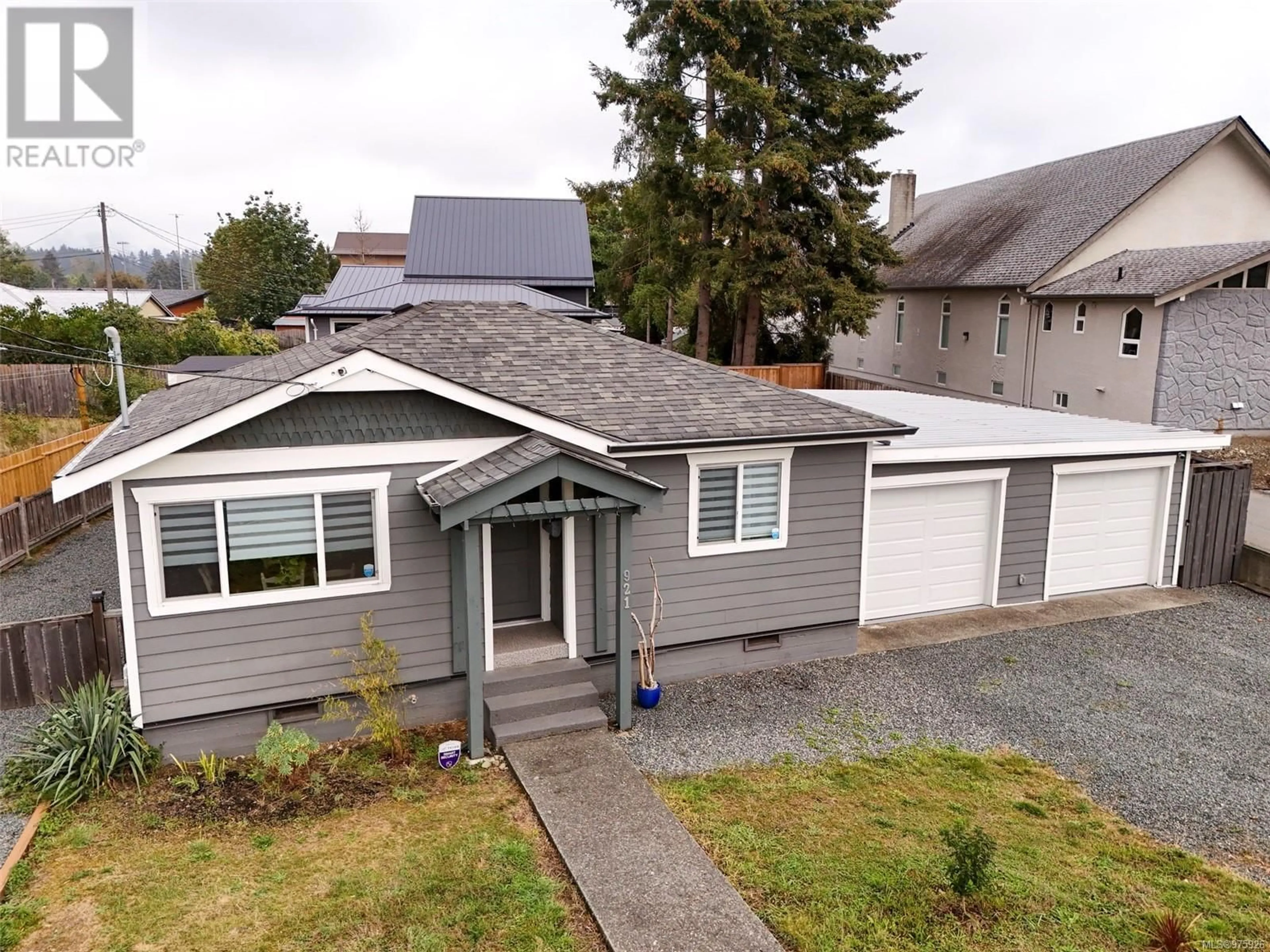 Frontside or backside of a home, the fenced backyard for 921 Trunk Rd, Duncan British Columbia V9L2R9