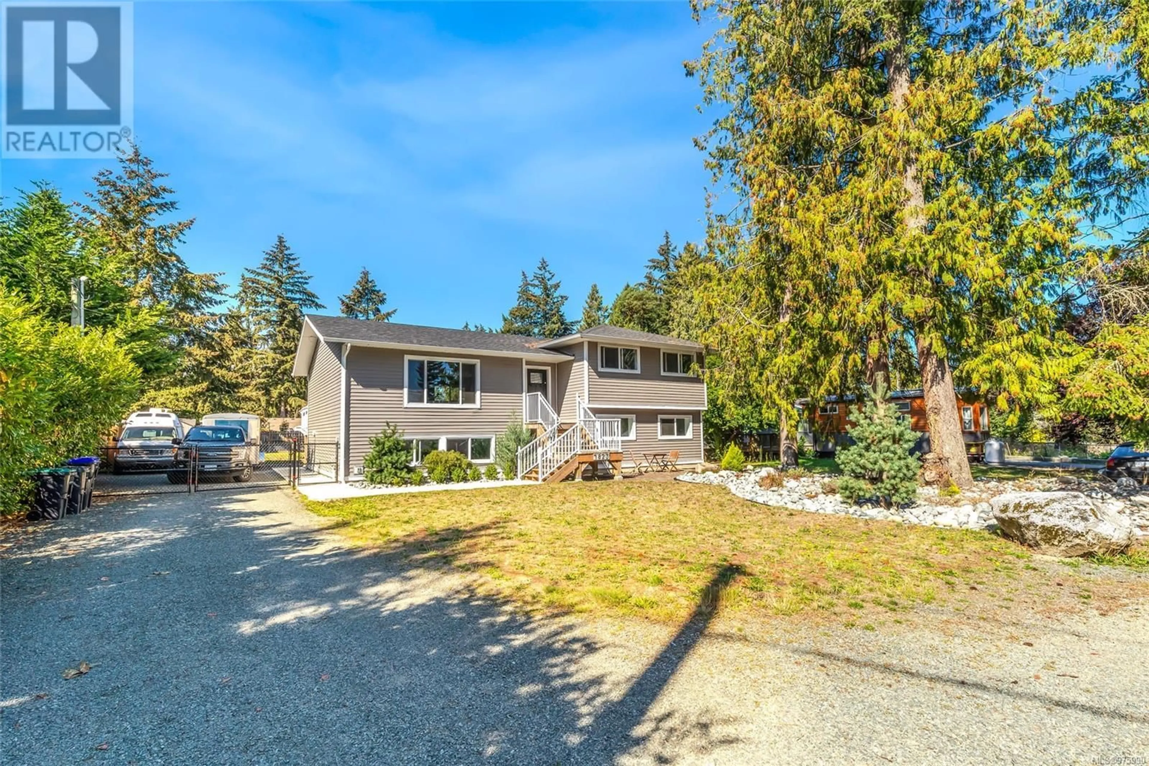 Frontside or backside of a home, the street view for 1823 Woobank Rd, Nanaimo British Columbia V9X1G8