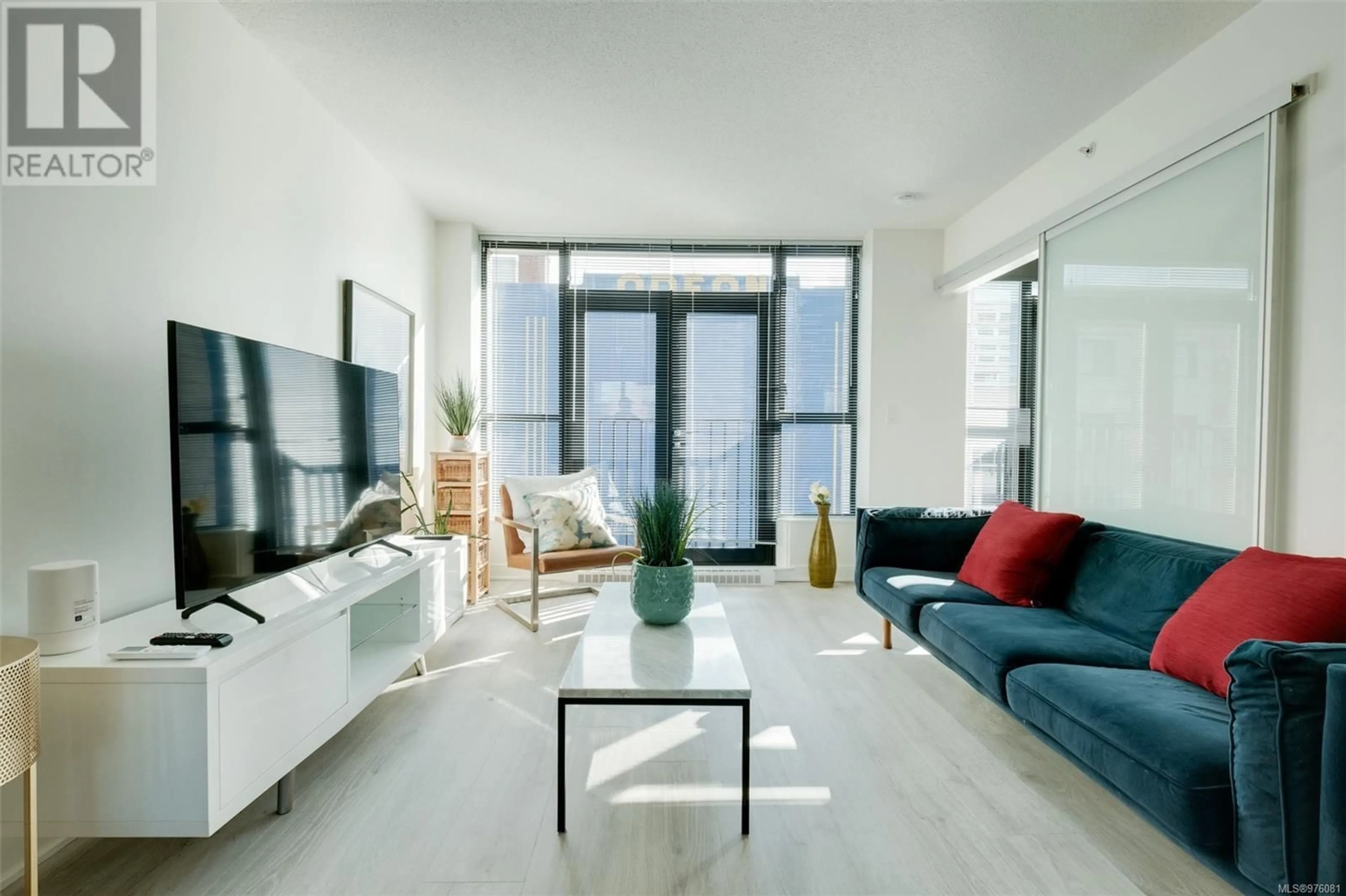 Living room, wood floors for 304 760 Johnson St, Victoria British Columbia V8W0A4