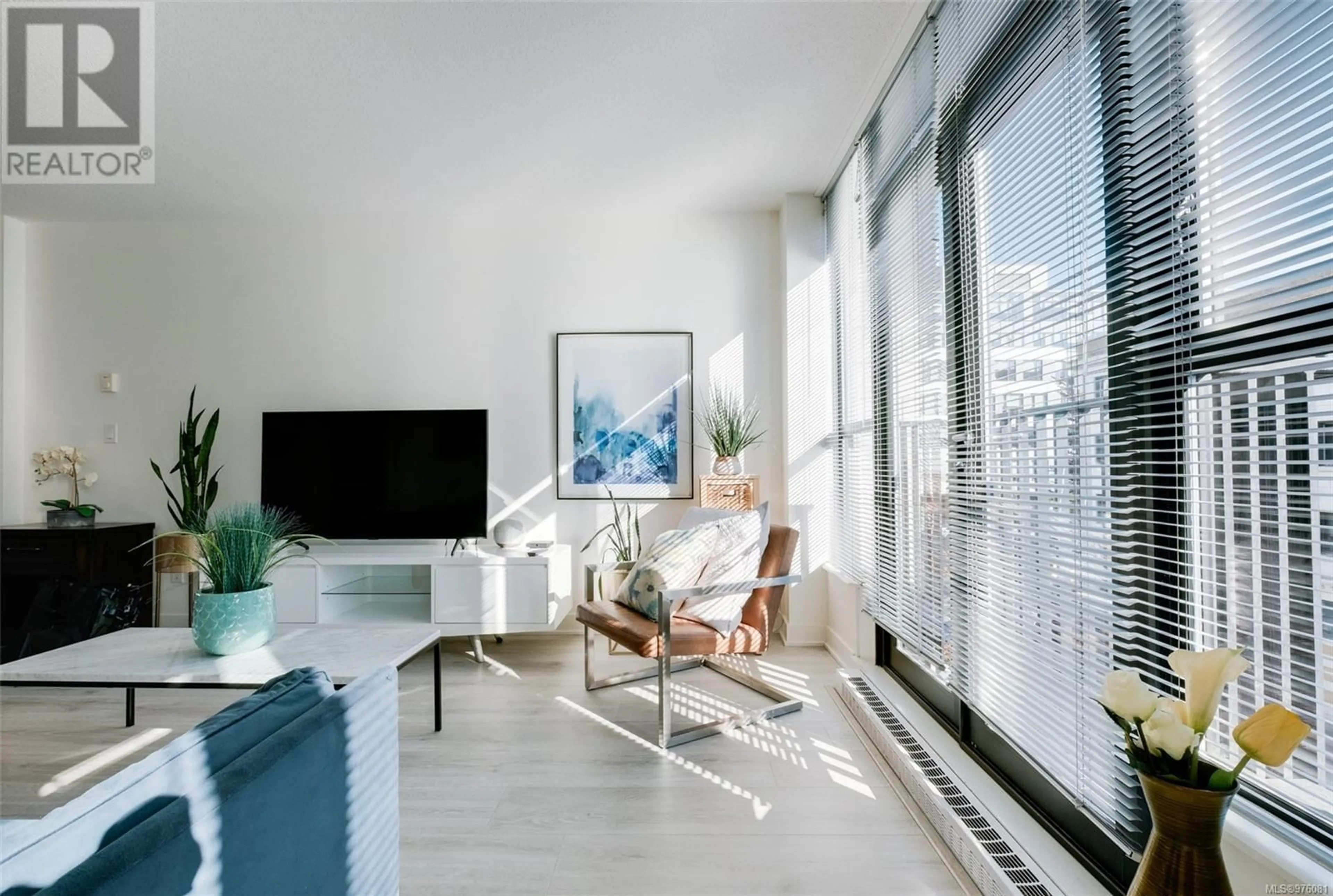 Living room, wood floors for 304 760 Johnson St, Victoria British Columbia V8W0A4