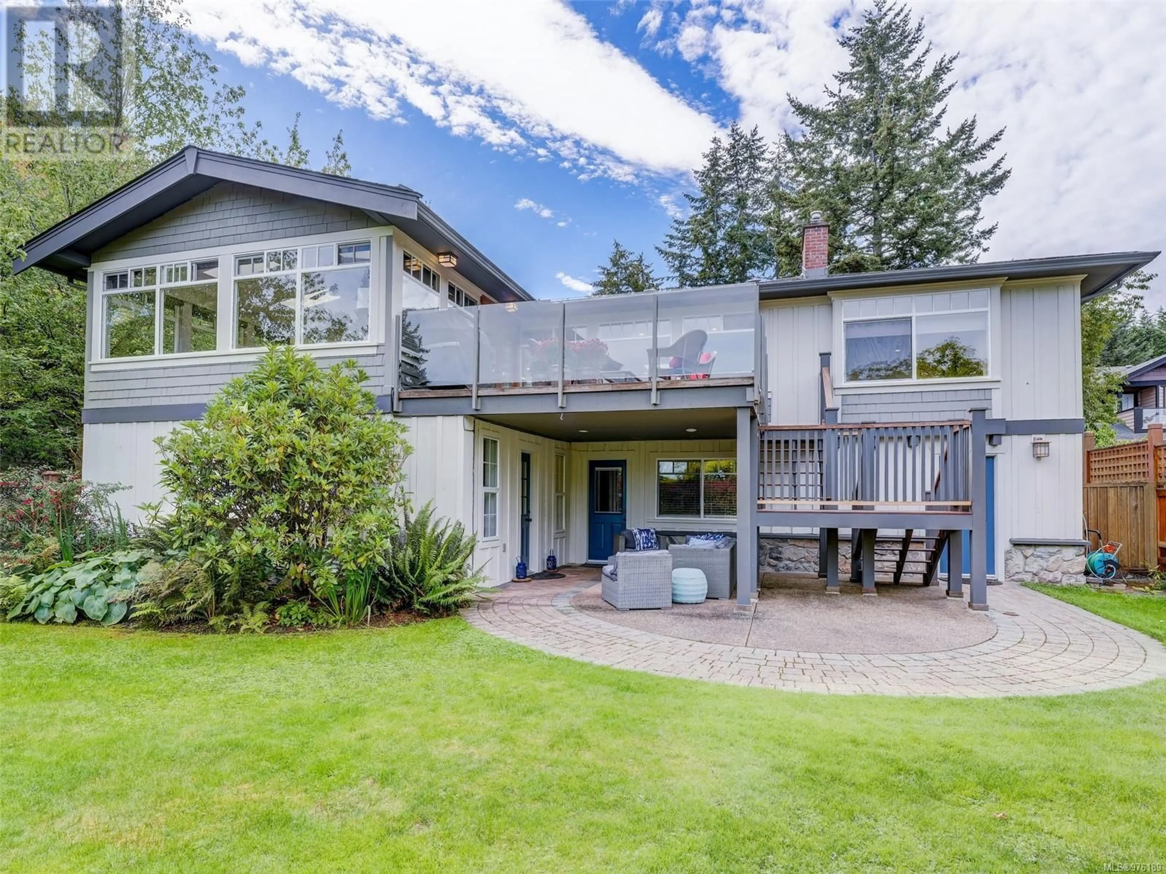 Frontside or backside of a home, the fenced backyard for 1204 Ocean Park Lane, Saanich British Columbia V8X5M6