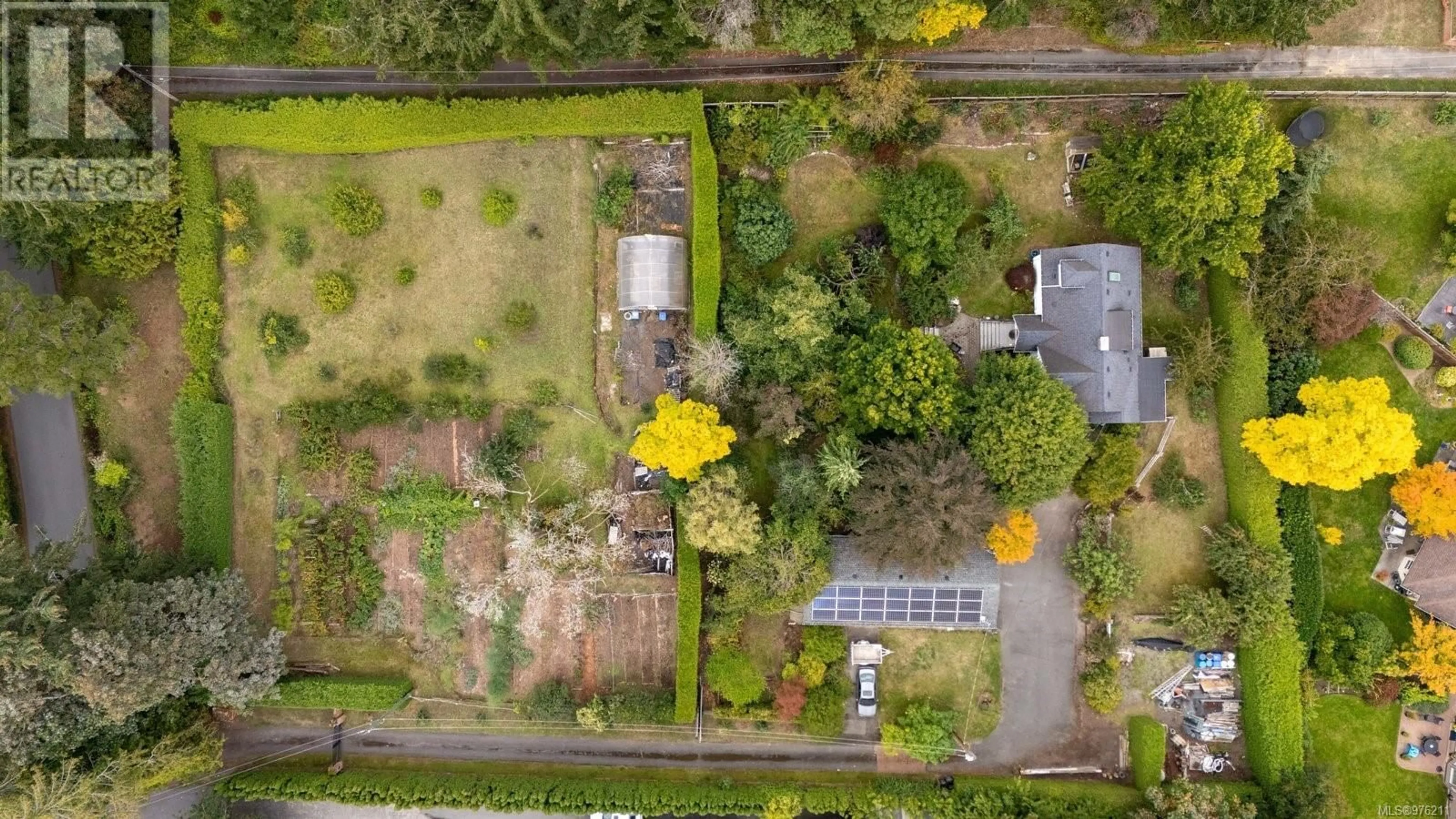 A pic from exterior of the house or condo, the fenced backyard for 5223 Santa Clara Ave, Saanich British Columbia V8Y1W6