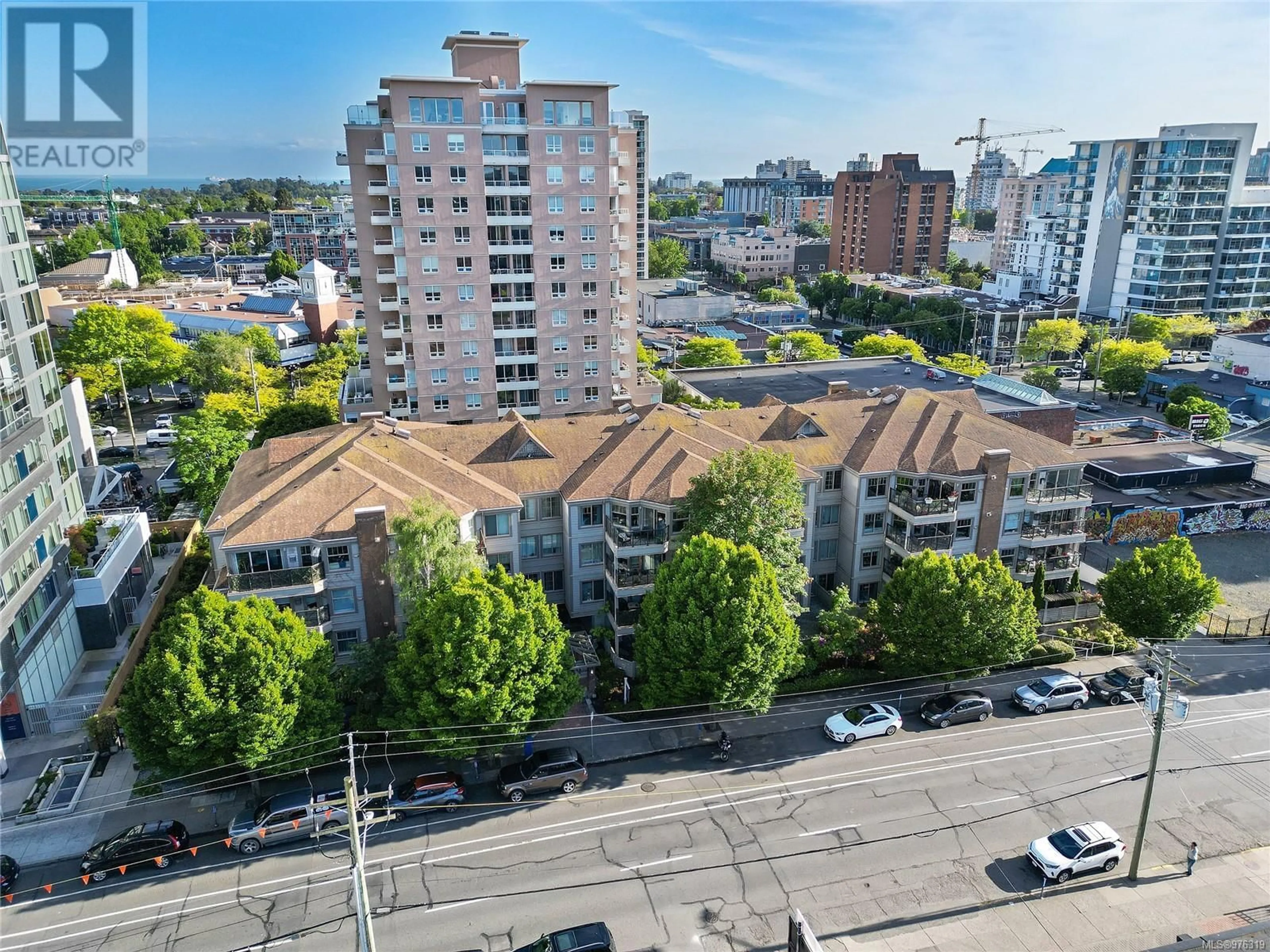 A pic from exterior of the house or condo, the view of city buildings for 401 935 Johnson St, Victoria British Columbia V8V3N5