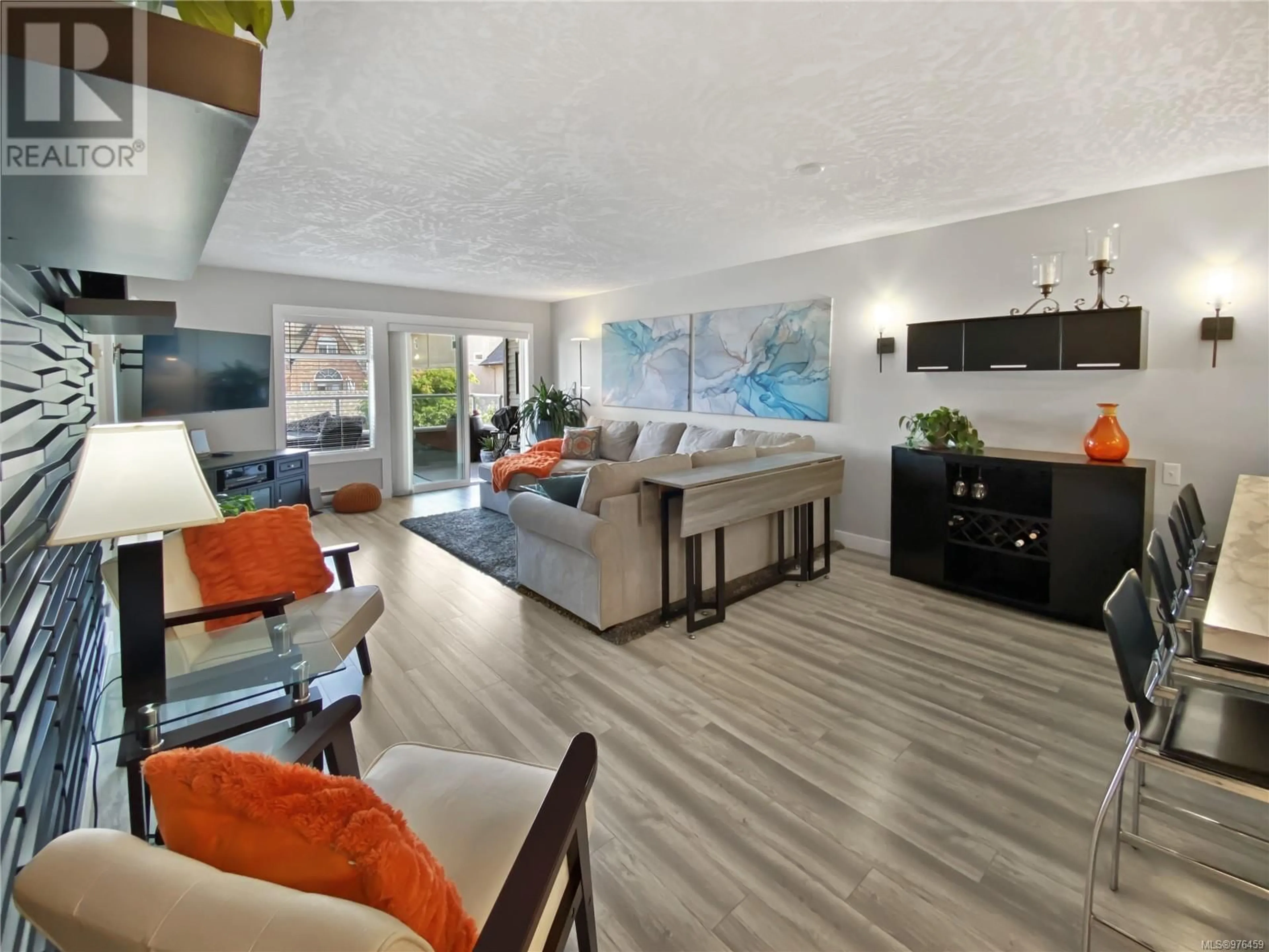 Living room with furniture, wood/laminate floor for 203 - 9710 SECOND STREET, Sidney British Columbia V8L3C4