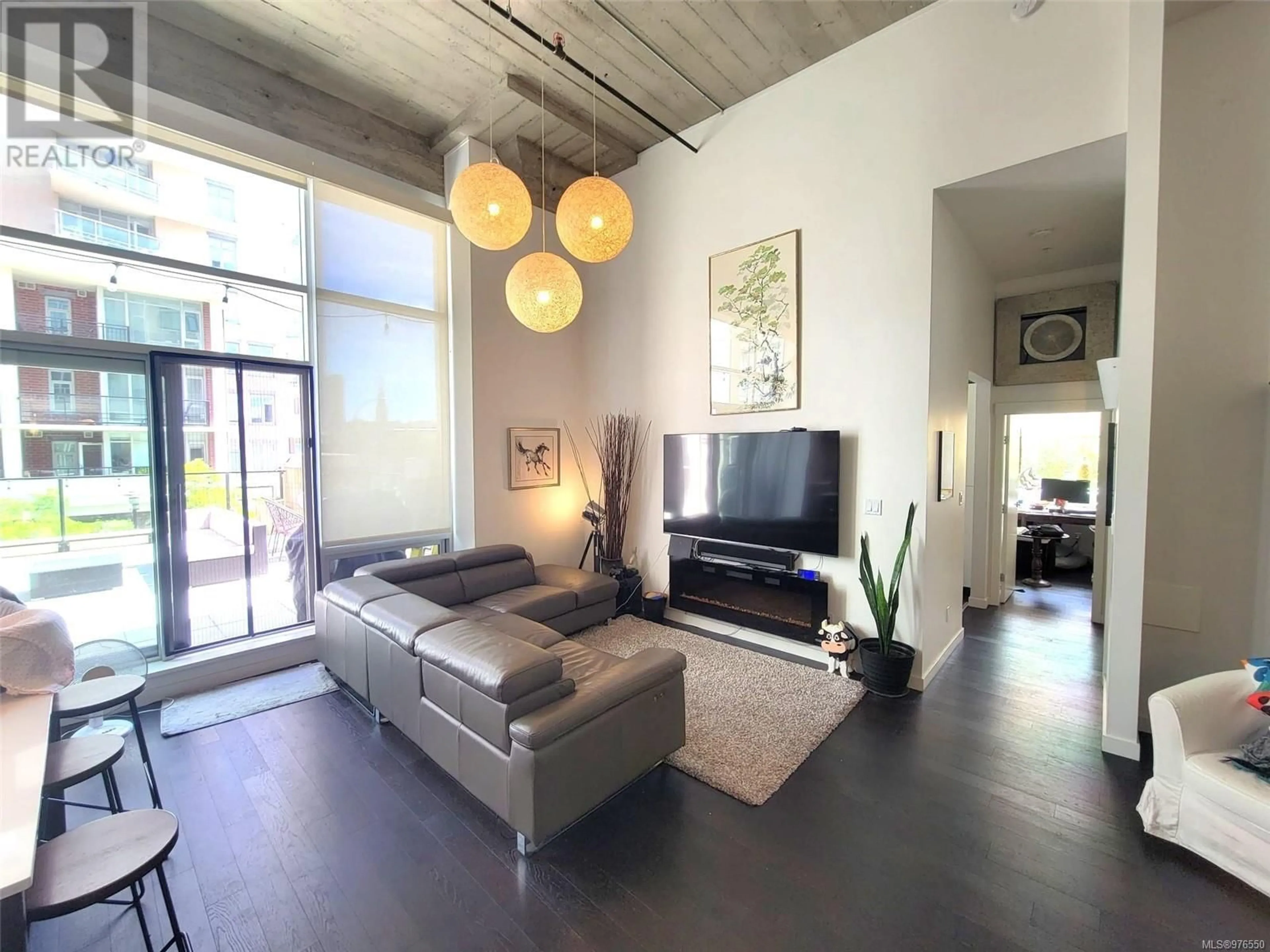 Living room, wood floors for 201 770 Fisgard St, Victoria British Columbia V8W0B8