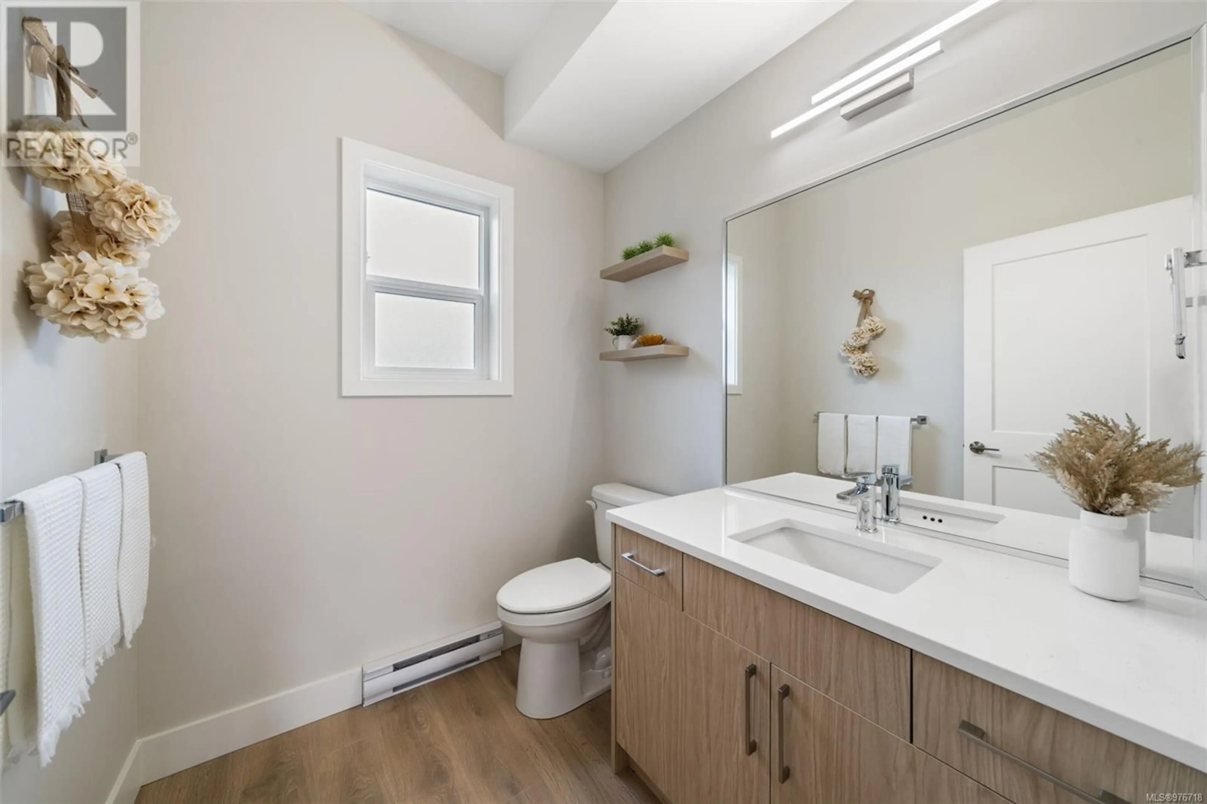 Standard bathroom, wood floors for 1203 Arcadiawood Crt, Langford British Columbia V9C2Z8