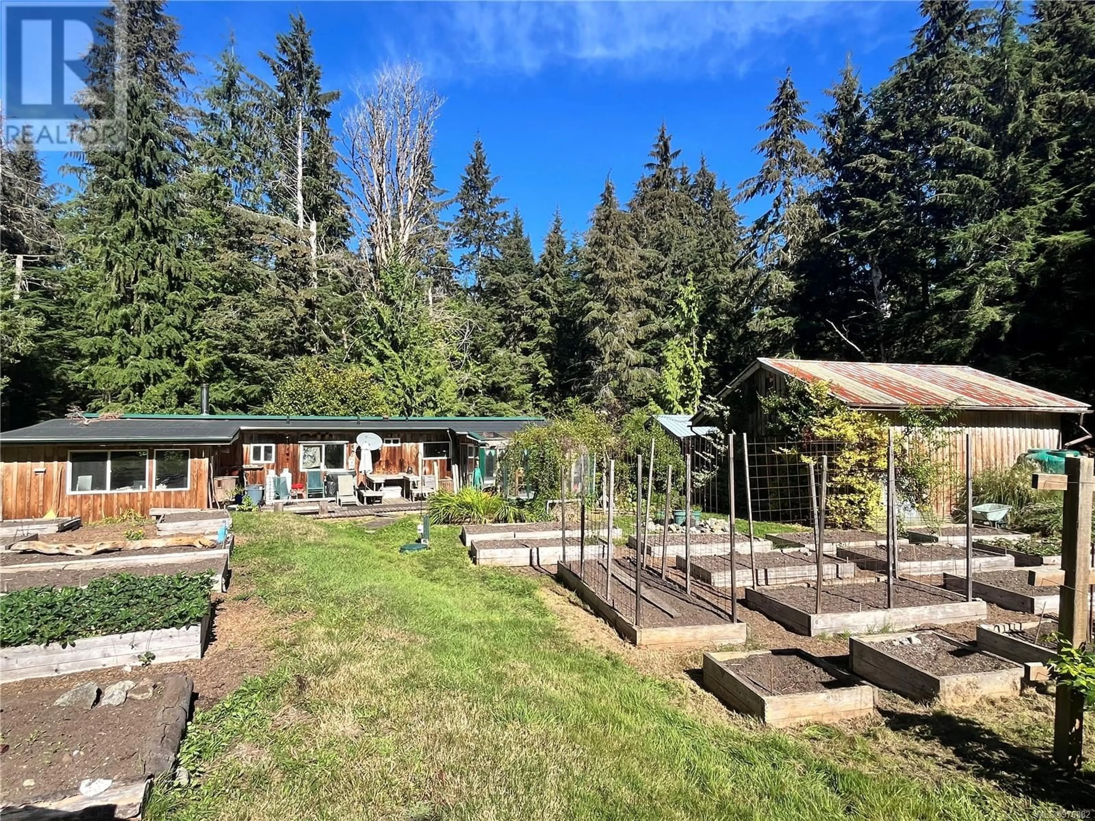 Patio, the fenced backyard for 323 Sawmill Rd, Whaletown British Columbia V0P1Z0