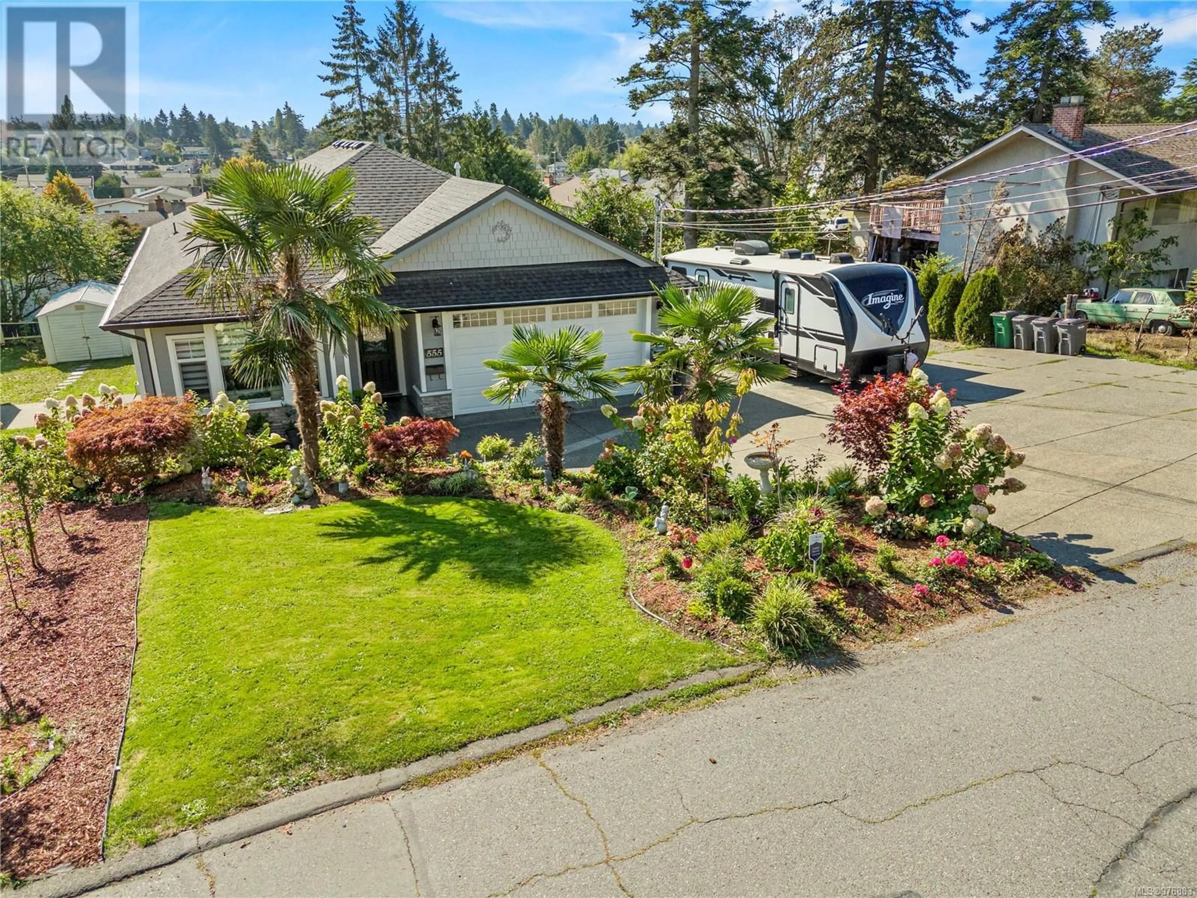 Frontside or backside of a home, the fenced backyard for 555 Leaside Ave, Saanich British Columbia V8Z2K9