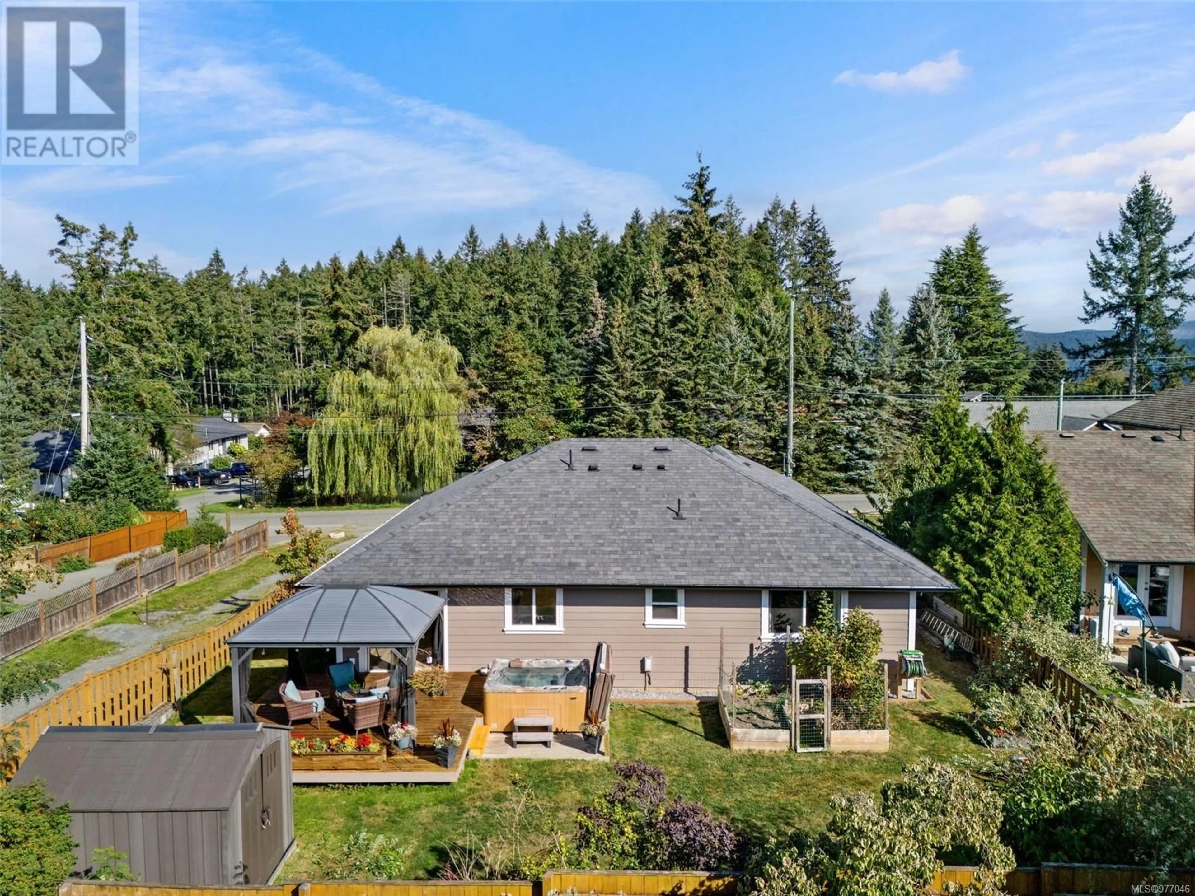 Frontside or backside of a home, the fenced backyard for 1586 Longwood Rd, Cowichan Bay British Columbia V0R1N0